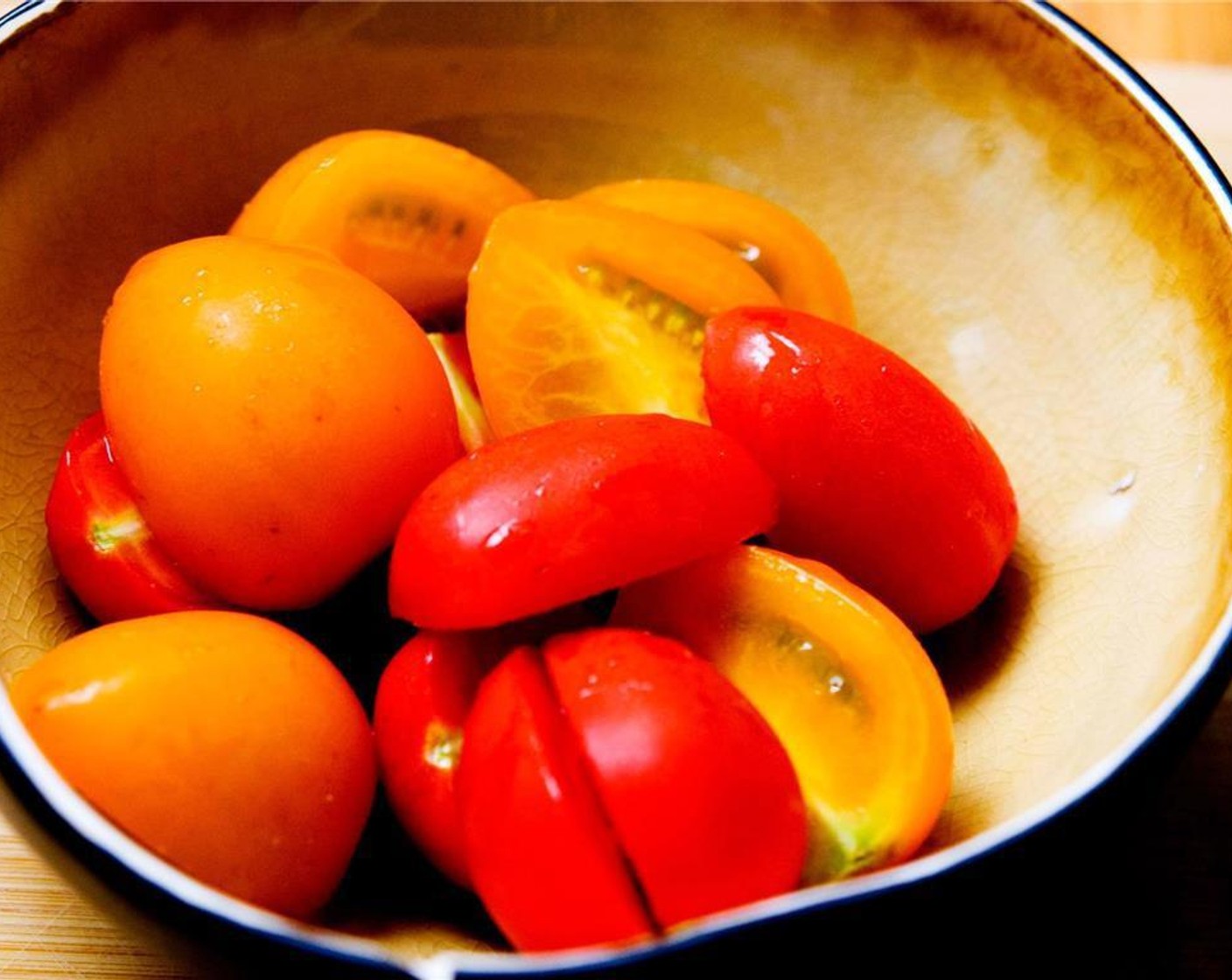 step 2 Wash and cut half of the Cherry Tomato (1 cup) put in a separate bowl.