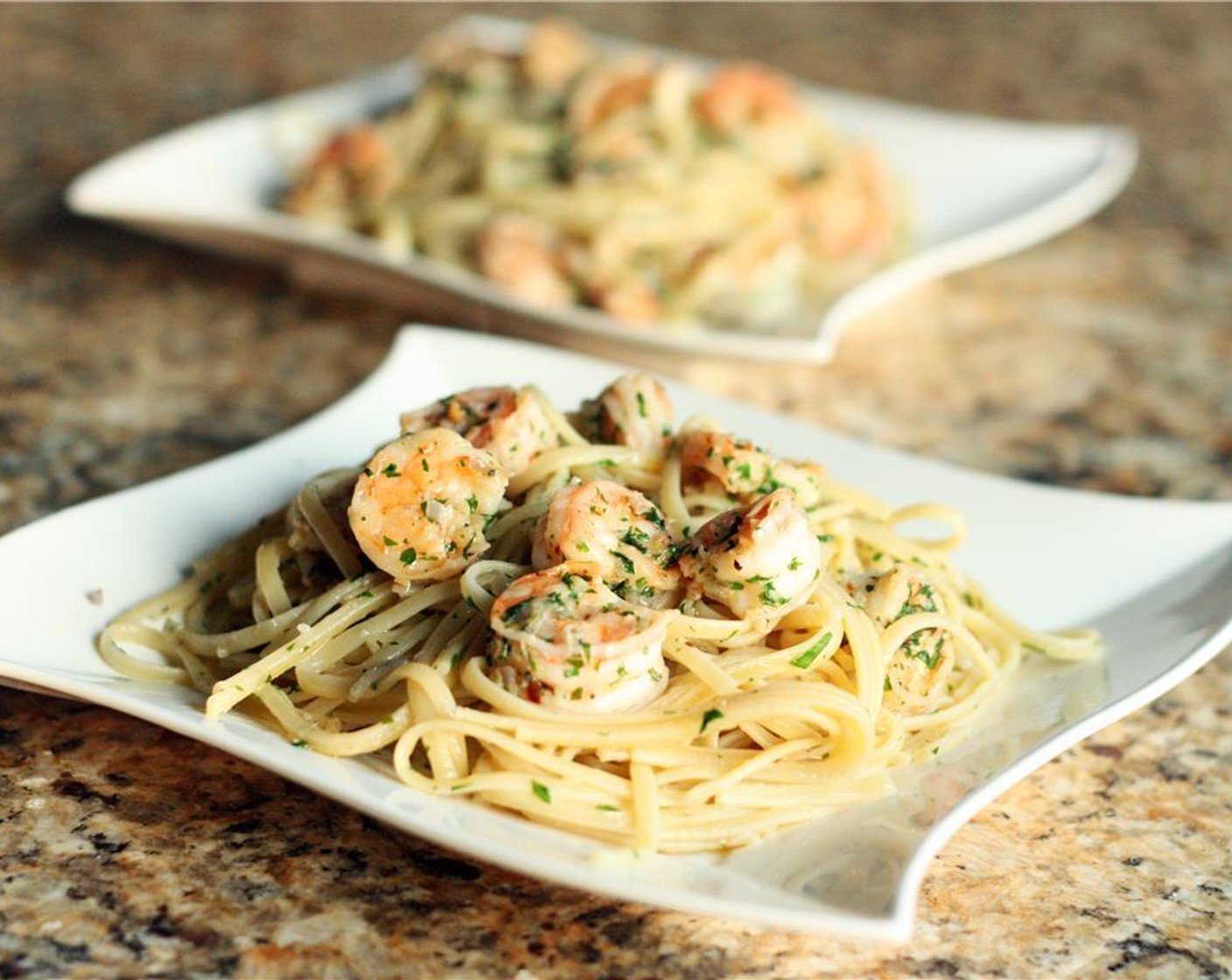 step 7 Scoop pasta and shrimp onto dinner plates and top generously with Parmesan Cheese (1/2 cup).