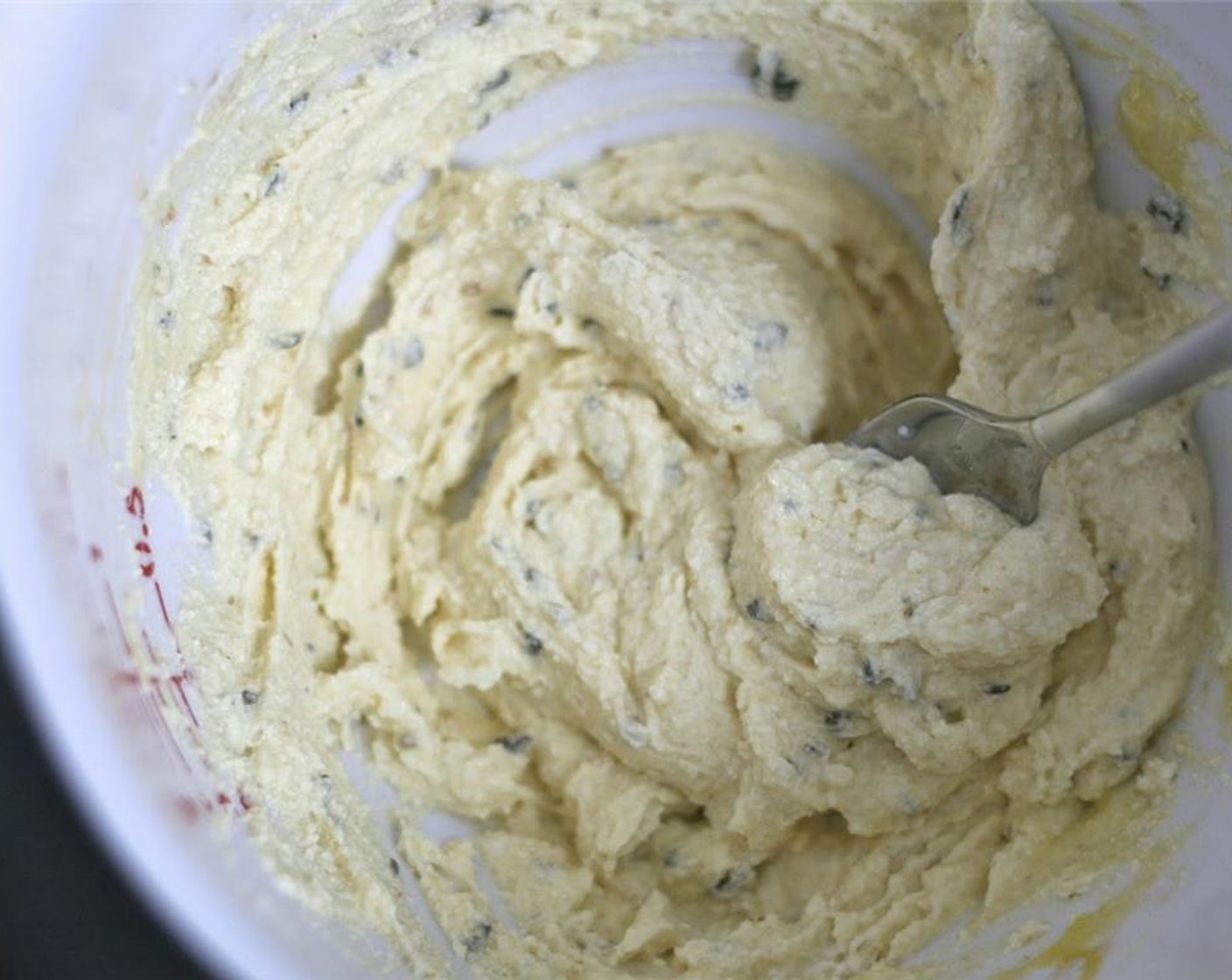 step 3 In a large bowl, thoroughly mix the strained ricotta, herb/butter mixture, Egg (1) and grated Parmesan Cheese (1/4 cup). Season with Salt (to taste) and Ground Black Pepper (to taste).