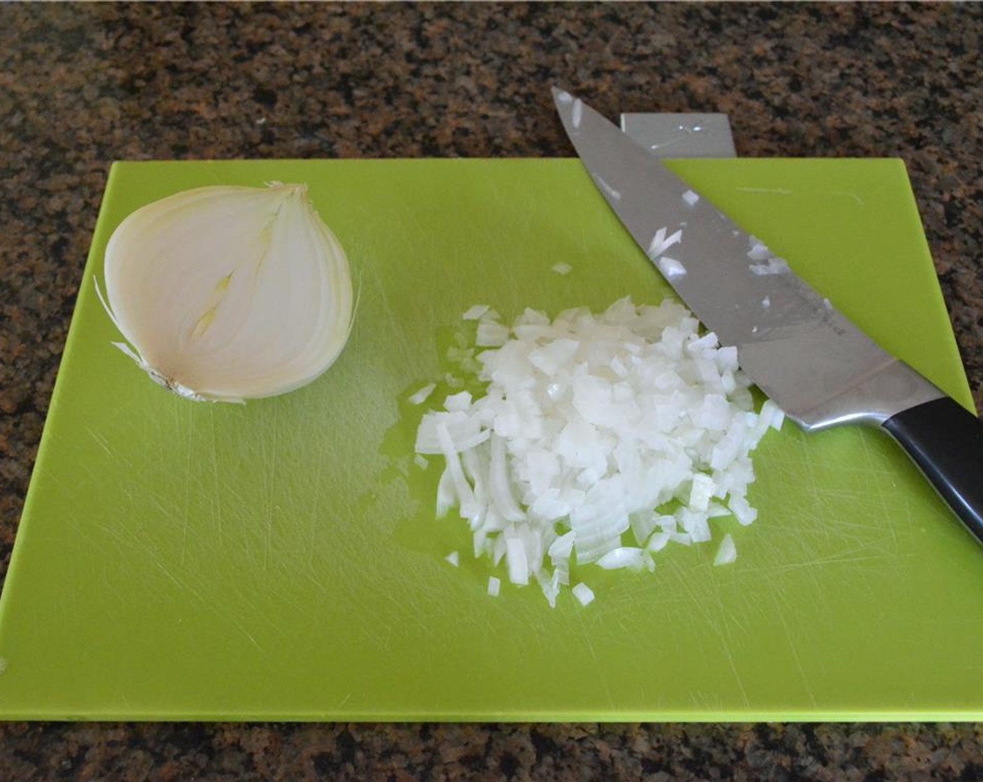 step 1 Finely dice the Onion (1/2) and mince the Garlic (1 clove).