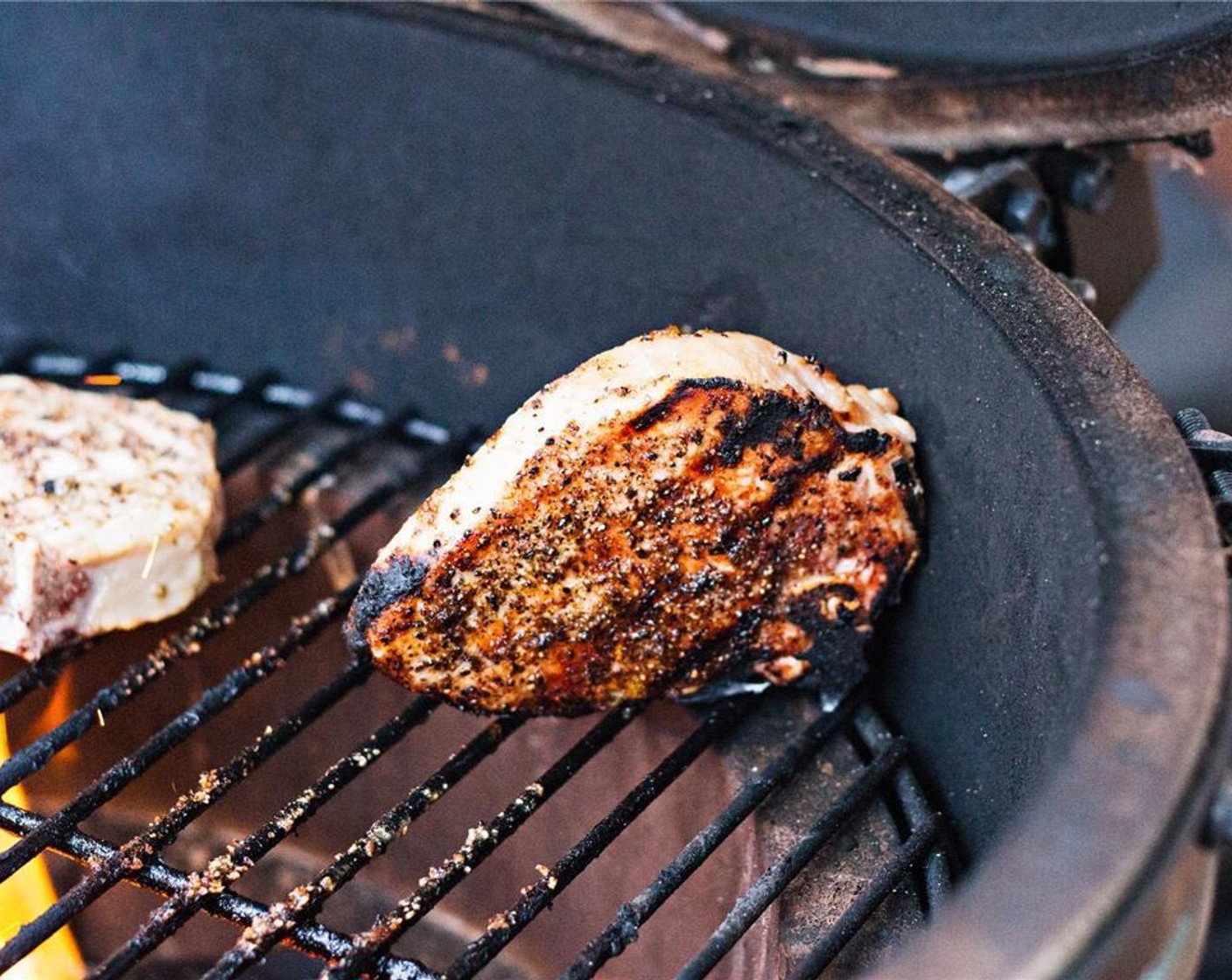 step 6 Flip and repeat on the other flat side. Shift the pork chops to a cooler portion of the grill.