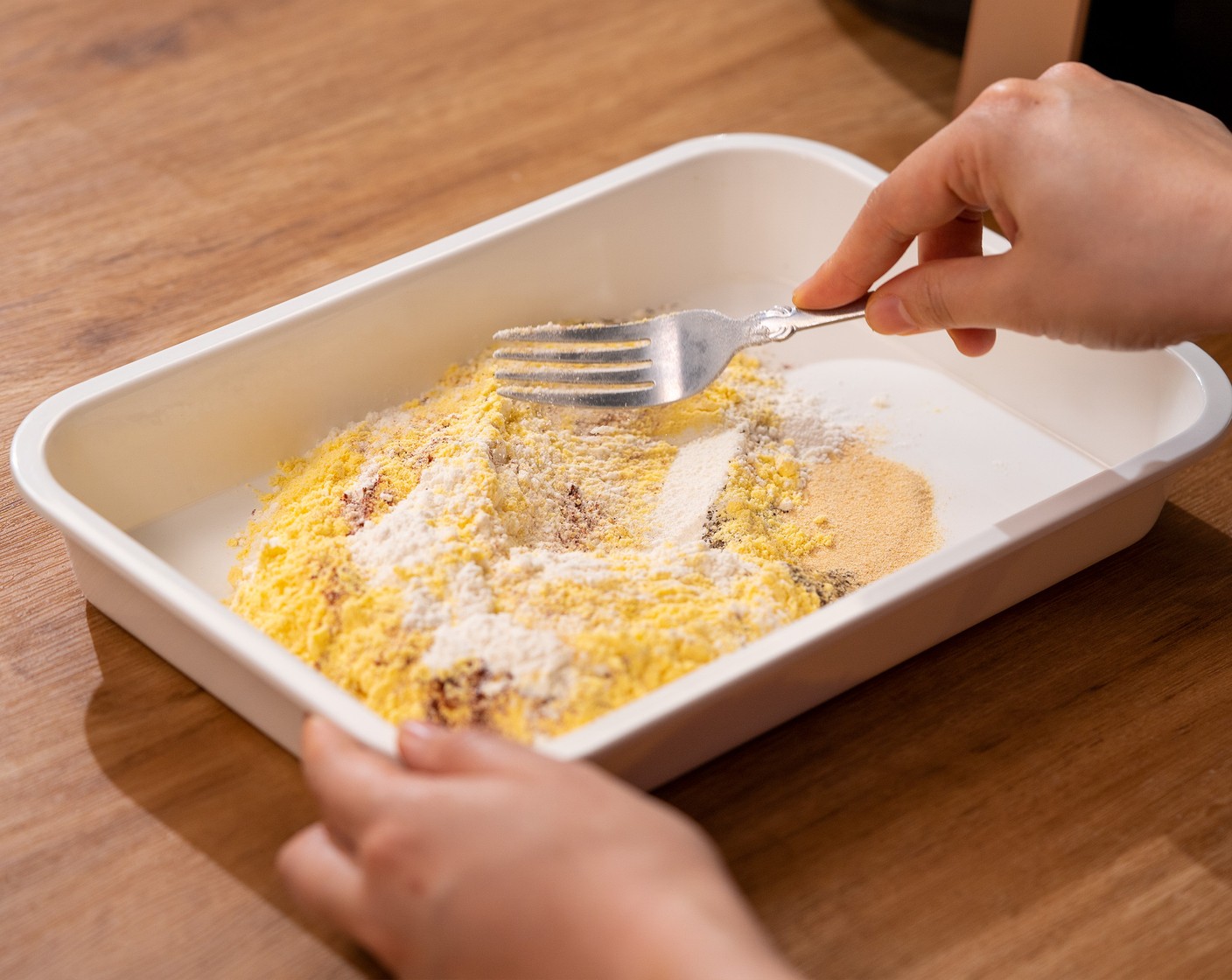 step 2 In a tray, combine the All-Purpose Flour (1/2 cup) and Fine Ground Cornmeal (3/4 cup) with Salt (1 tsp), Ground Black Pepper (1/2 tsp), Smoked Paprika (1 tsp), and McCormick® Garlic Powder (1 tsp).