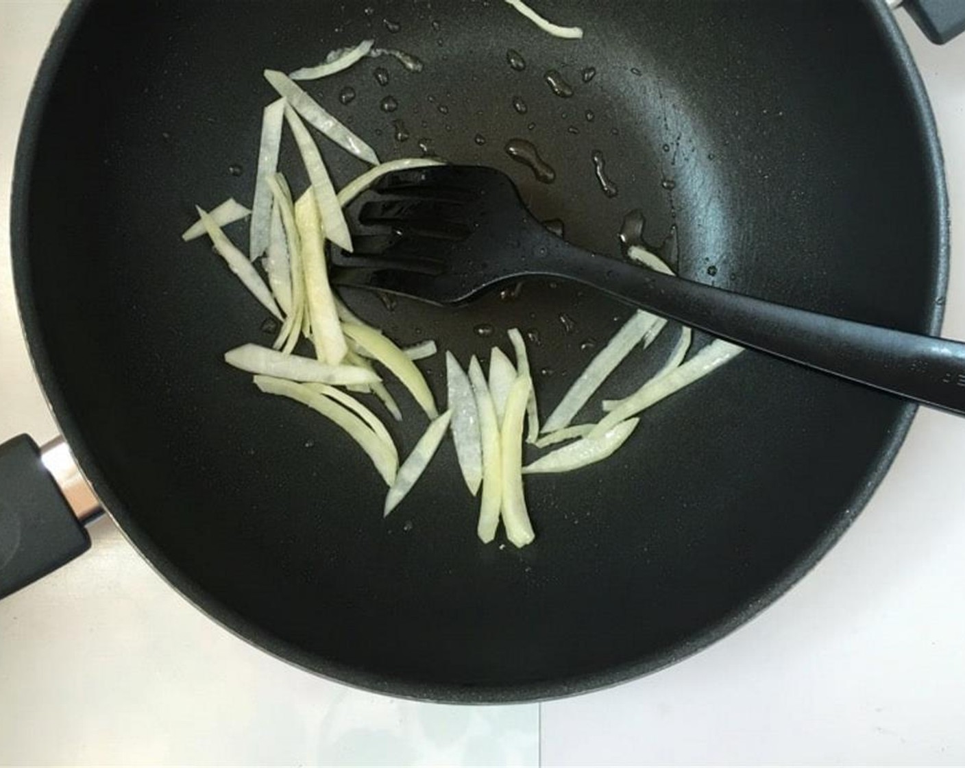 step 3 Add the rest of the Vegetable Oil (1 1/2 Tbsp) to the wok together with the Onion (1). Stir fry the onion over high heat for 2 minutes.