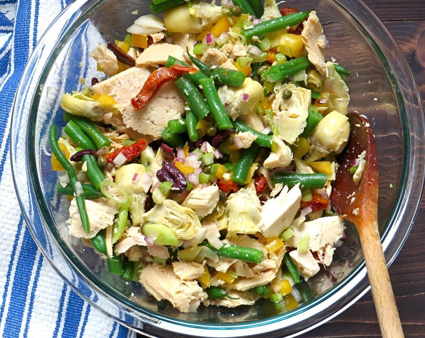 step 4 Meanwhile, in a large bowl add the Yellow Bell Pepper (1), Celery (1 stalk), Red Onion (1/2 cup), Nicoise Olive (1/2 cup), Sun-Dried Tomatoes in Olive Oil (1/2 cup), Capers (2 Tbsp), Baby Artichokes (1 jar), and Canned Tuna (2 cans). Toss to combine.