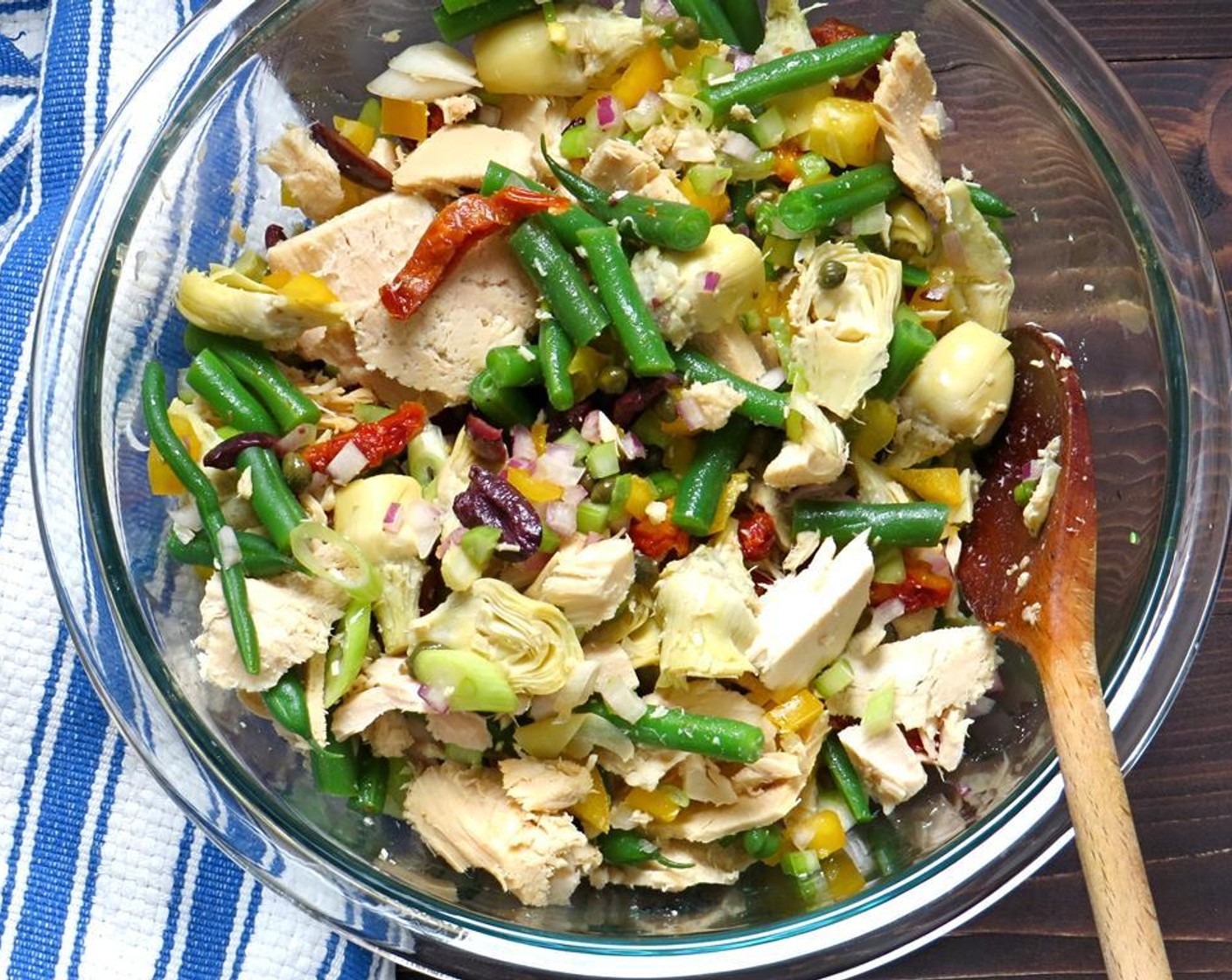 step 14 Meanwhile, in a large bowl add the bell pepper, celery, green beans, red onion, olives, sun-dried tomatoes, Capers (2 Tbsp), artichokes and tuna. Toss to combine.