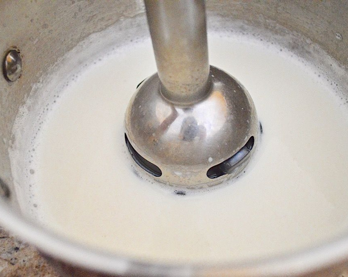 step 5 Once the milk starts to bubble, take it off the heat and use an immersion blender to get it nice and frothy.