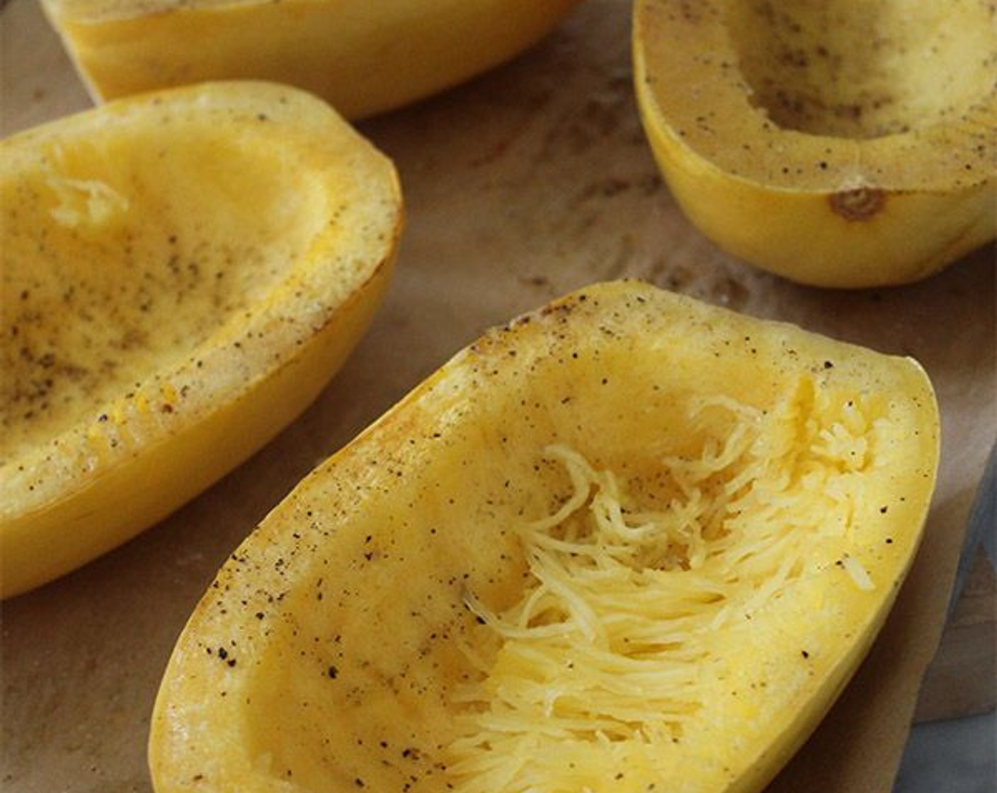 step 3 Brush the cavities of the squash lightly with olive oil, and sprinkle with Kosher Salt (1 tsp), and Freshly Ground Black Pepper (1/2 tsp).