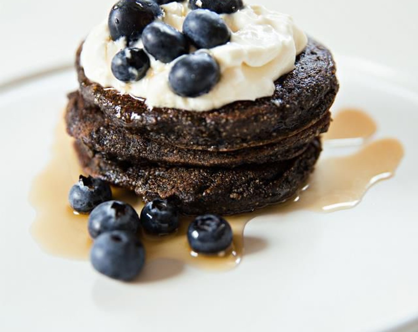 step 6 Stack cooked pancakes on to a plate and top with Greek Yogurt (1/2 cup) and Fresh Blueberry (1/2 cup). Drizzle with Maple Syrup (to taste). Serve and enjoy!