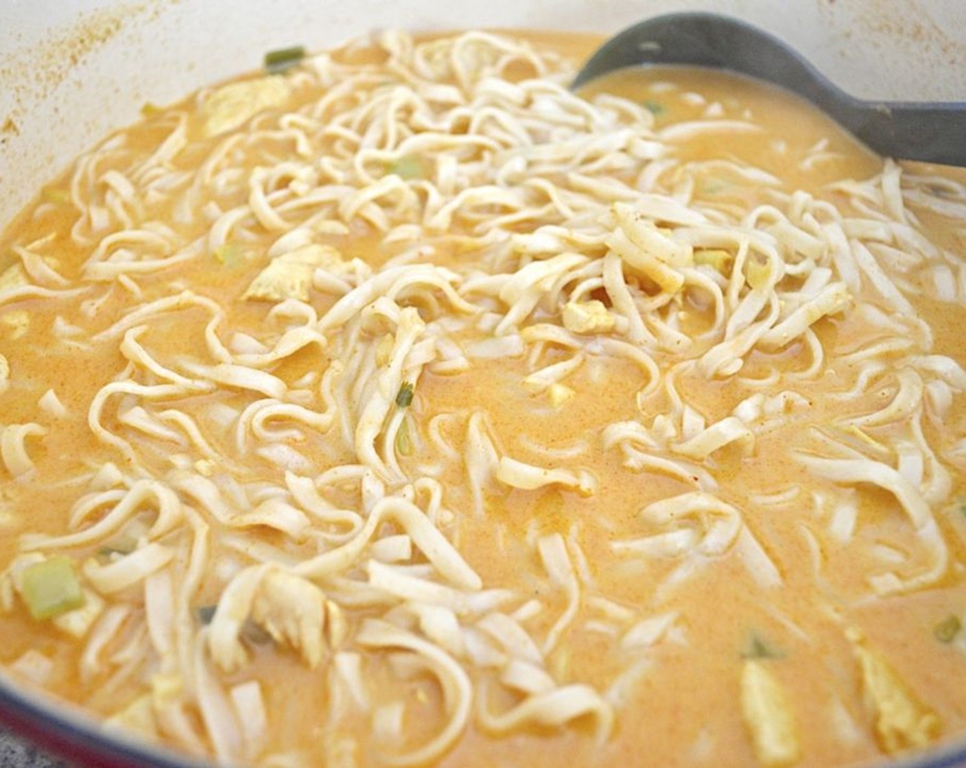 step 5 When time is almost up, boil the Rice Noodles (2 pckg) in another pot according to the directions. Usually, they only take 2-4 minutes. Drain them and toss them into the pot of soup.