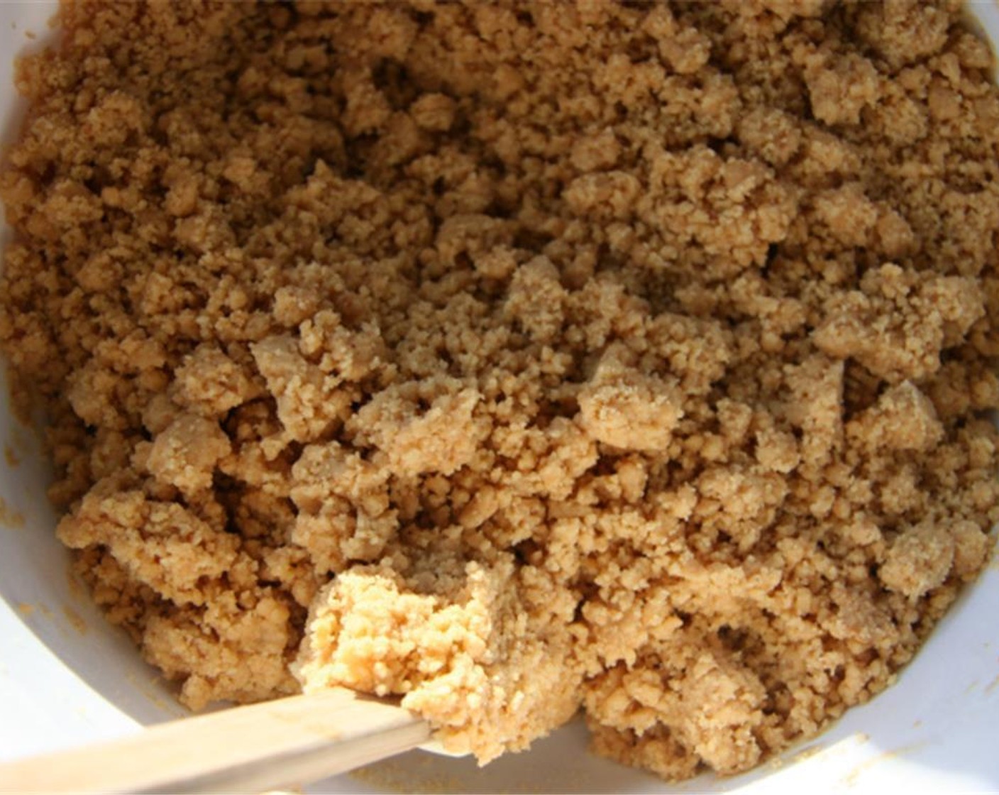 step 4 Add the flour mixture to the peanut butter mixture a little at a time until crumbly.