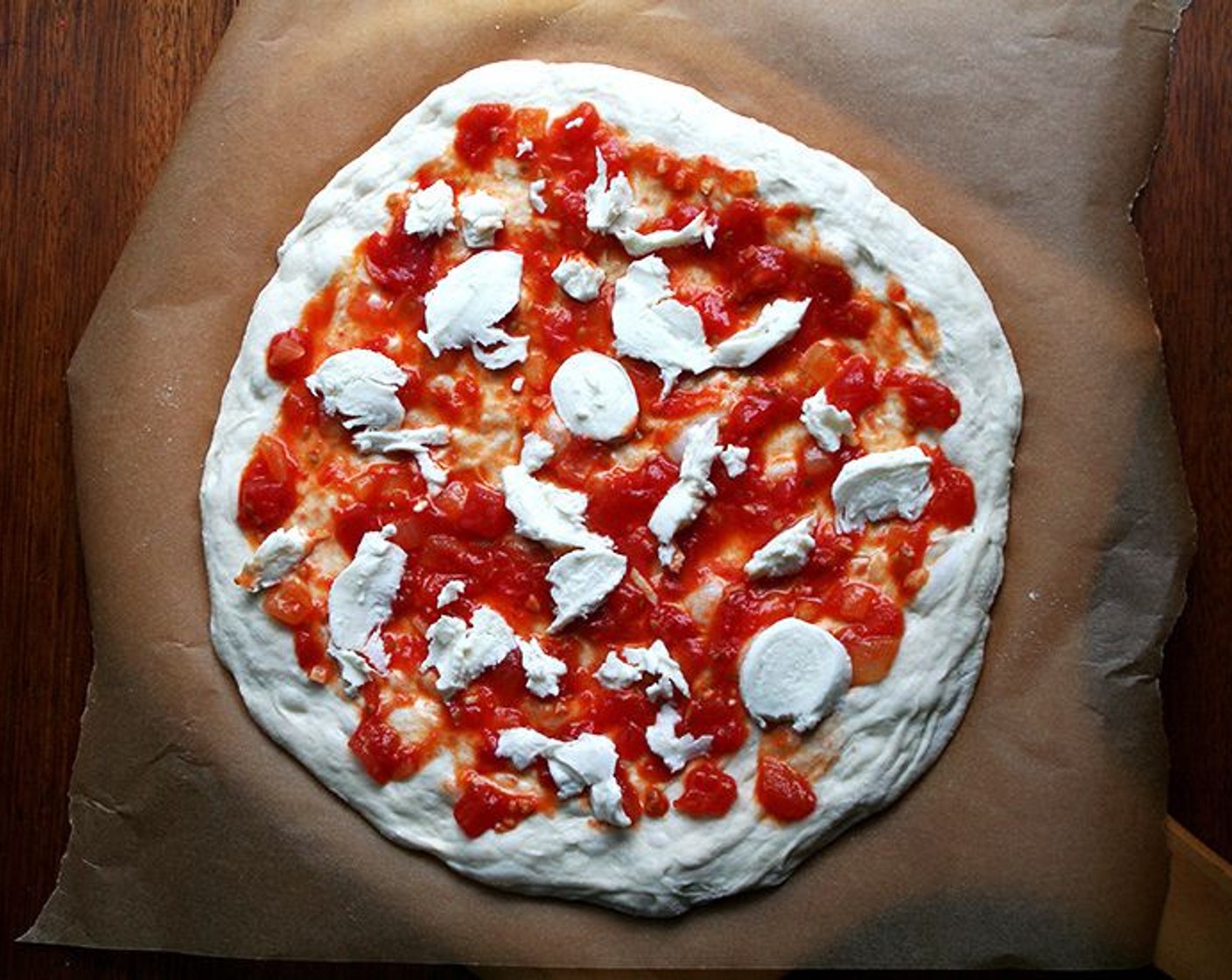 step 10 Top with a light layer of Fresh Mozzarella Cheese Ball (to taste). Drizzle with Olive Oil (to taste). Sprinkle with Sea Salt (to taste). Shimmy topped dough parchment paper and all onto preheated Steel. Bake for about 5 minutes or until blistered at the edges, bubbling all over.