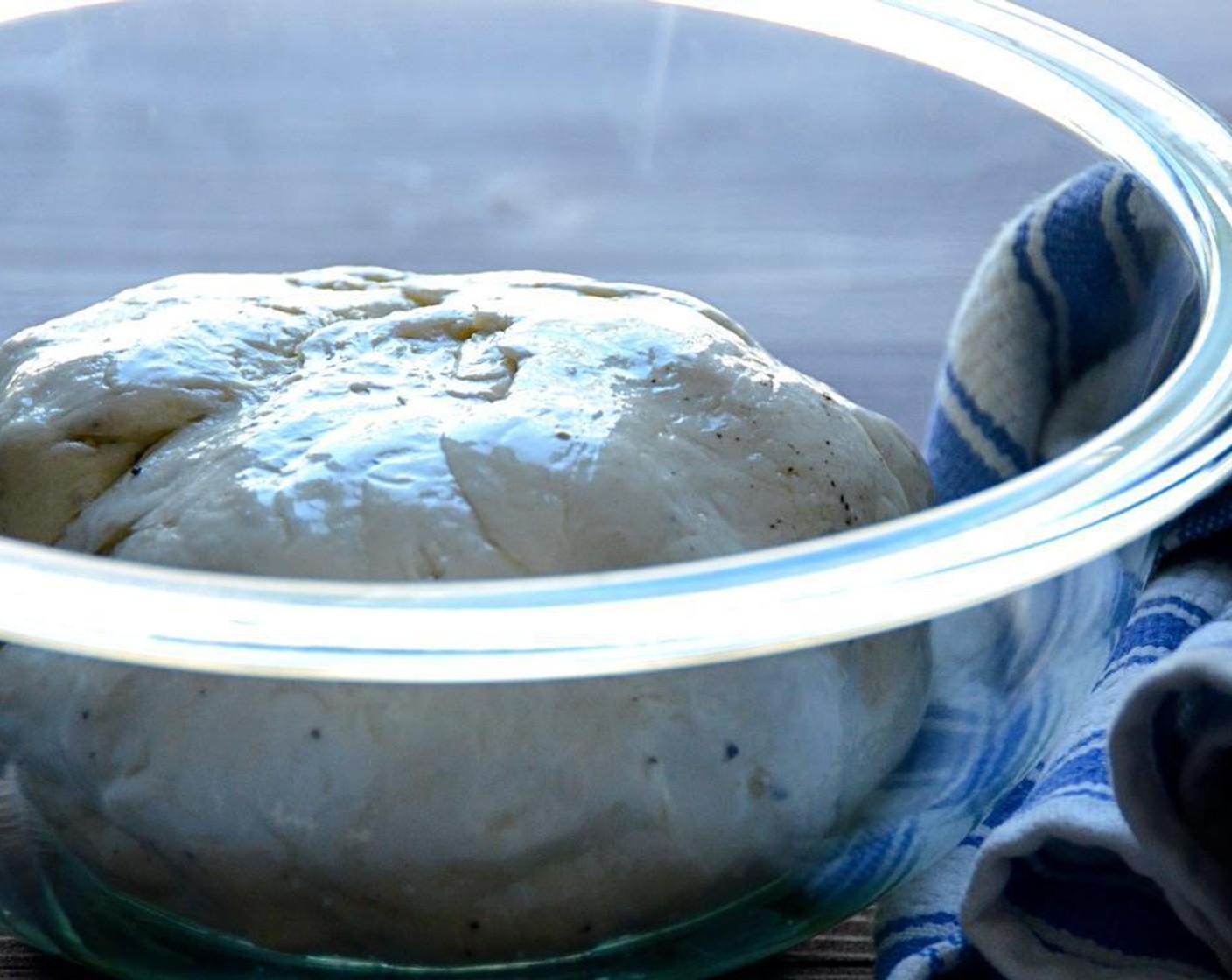 step 5 Remove the bowl from the stand. Shape the dough into a round ball and set in the bowl. Pour the Extra-Virgin Olive Oil (1 Tbsp) over the dough and turn the dough over until it is well coated with olive oil.