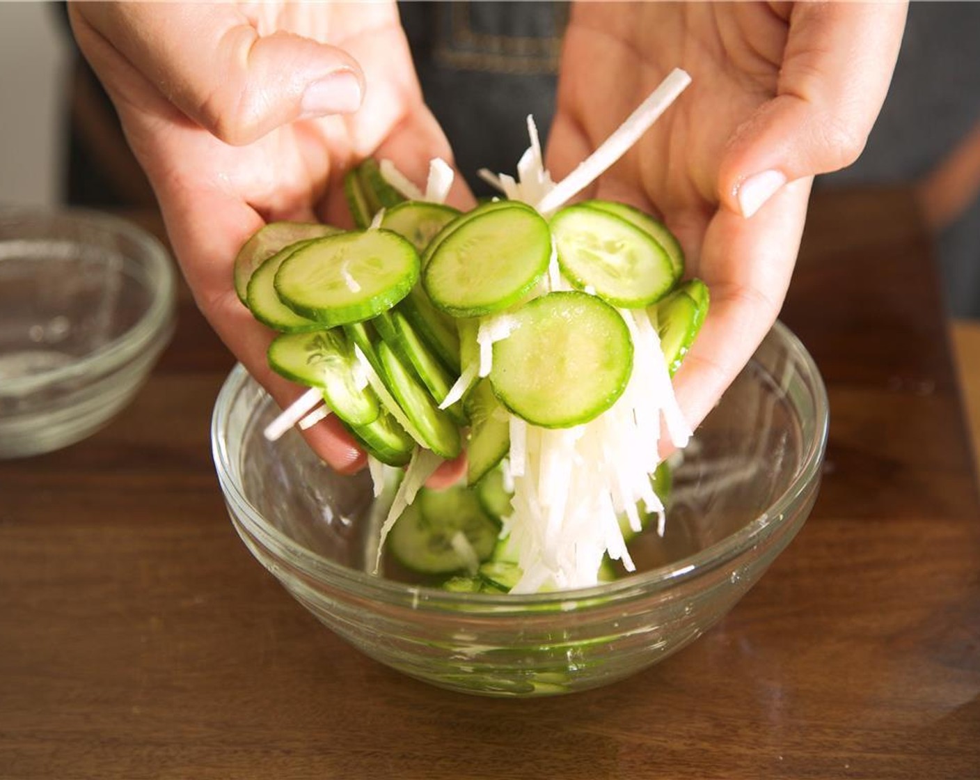 step 3 To make the dressing, pour Rice Vinegar (2 Tbsp) into second small bowl. Add the Granulated Sugar (3 Tbsp) and stir until dissolved. Drizzle the dressing over the jicama and cucumber and gently toss, hold until plating.