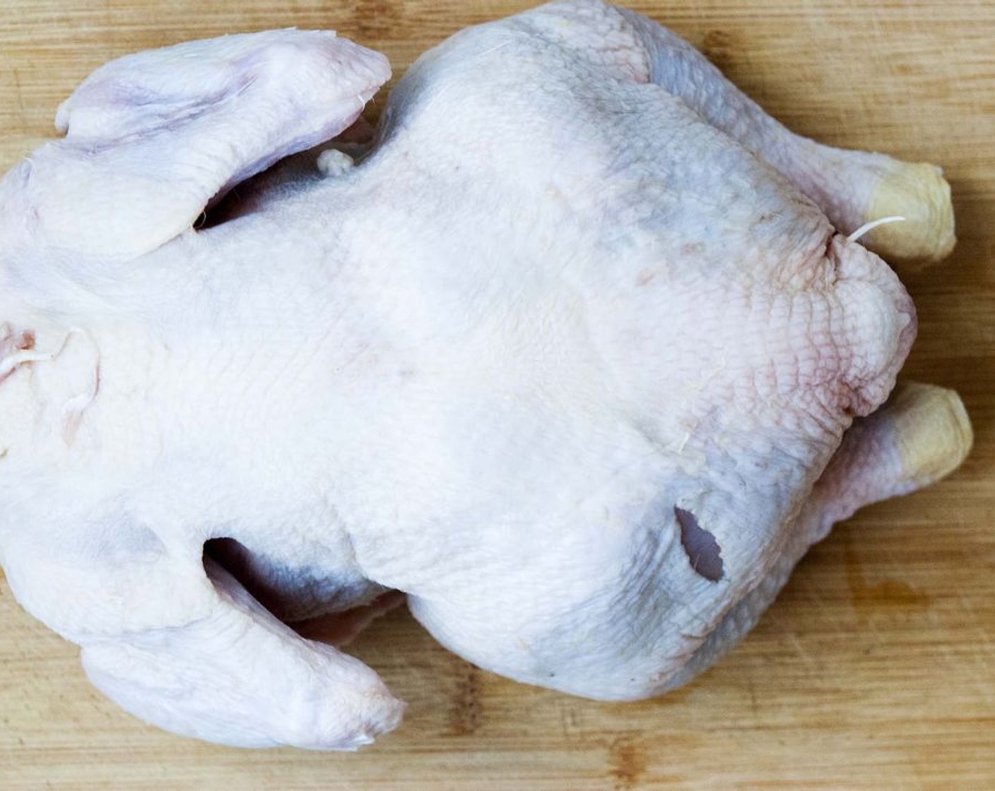 step 2 Remove the Whole Chicken (1) from its packaging, rinse inside and out and pat dry with paper towels. Season the inside with Salt (to taste) and Ground Black Pepper (to taste).