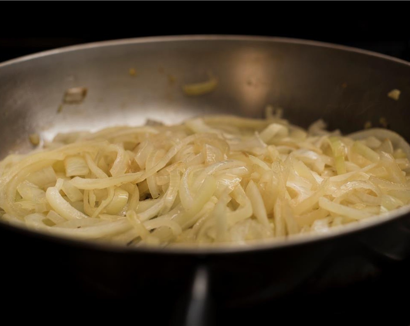 step 4 To caramelize onions, Melt the Unsalted Butter (2 Tbsp) and Olive Oil (2 Tbsp) in a large saute pan over medium heat. Add the Yellow Onions (3). Cook, stirring occasionally for 35 to 40 minutes until soft and caramelized.