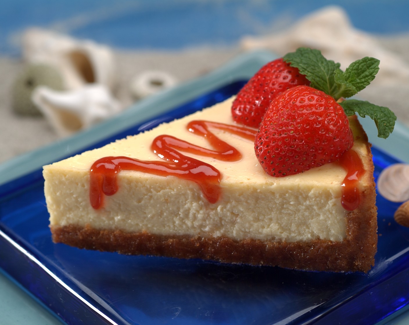 step 8 Arrange Fresh Strawberries (to taste) over the top of the cheesecake and drizzle with Strawberry Jam (1/2 cup). Garnish with Fresh Mint (to taste).