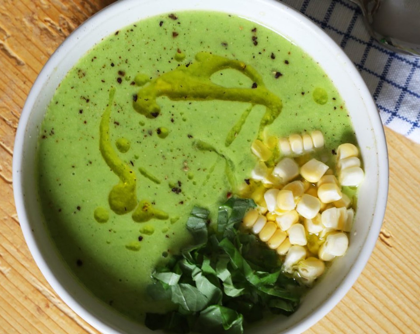 step 5 Chill the soup for at least 1 hour, or overnight, and serve cold, garnished with a drizzle of oil, the reserved Corn Kernels (1/4 cup), and torn fresh basil leaves.