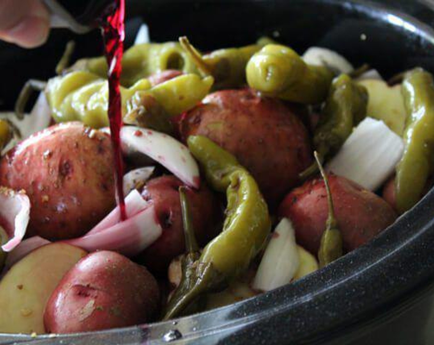 step 3 Pour 1/2 cup of the juice from the pickled peppers over the meat and vegetables. Follow with pouring the Dry Red Wine (1 cup) over the top.