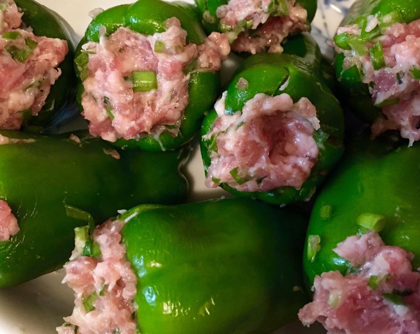 step 5 Stuff the meat into the green peppers evenly.
