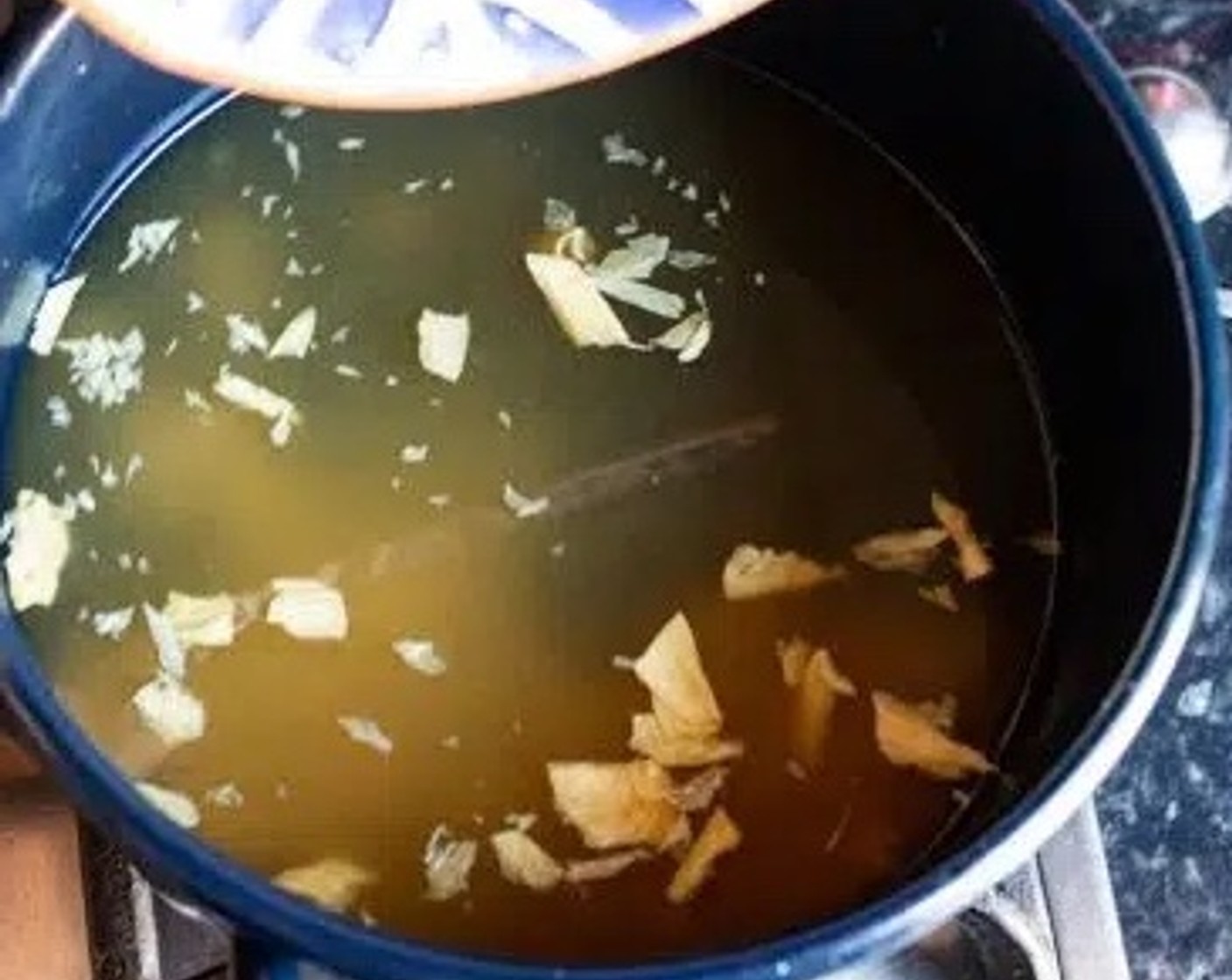step 1 In a saucepan, add Garlic (1 clove), Fresh Ginger (1/2 tsp), Vegetable Broth Powder (1/2 Tbsp), and Dried Beancurd Stick (1/2). Cook on high heat until it starts to boil.