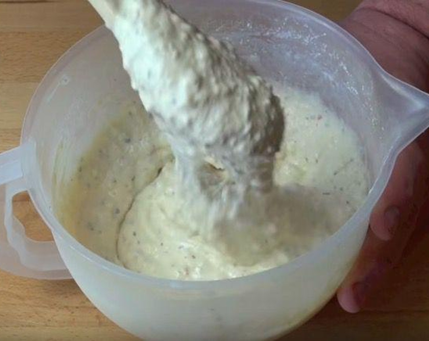 step 3 In a mixing bowl, add Self-Rising Flour (2 1/2 cups), Italian Seasoning (1 Tbsp), Salt (to taste), and Ground Black Pepper (to taste). Make a well in the center and add Eggland's Best Classic Egg (1) and Milk (1 cup). Mix until combined.