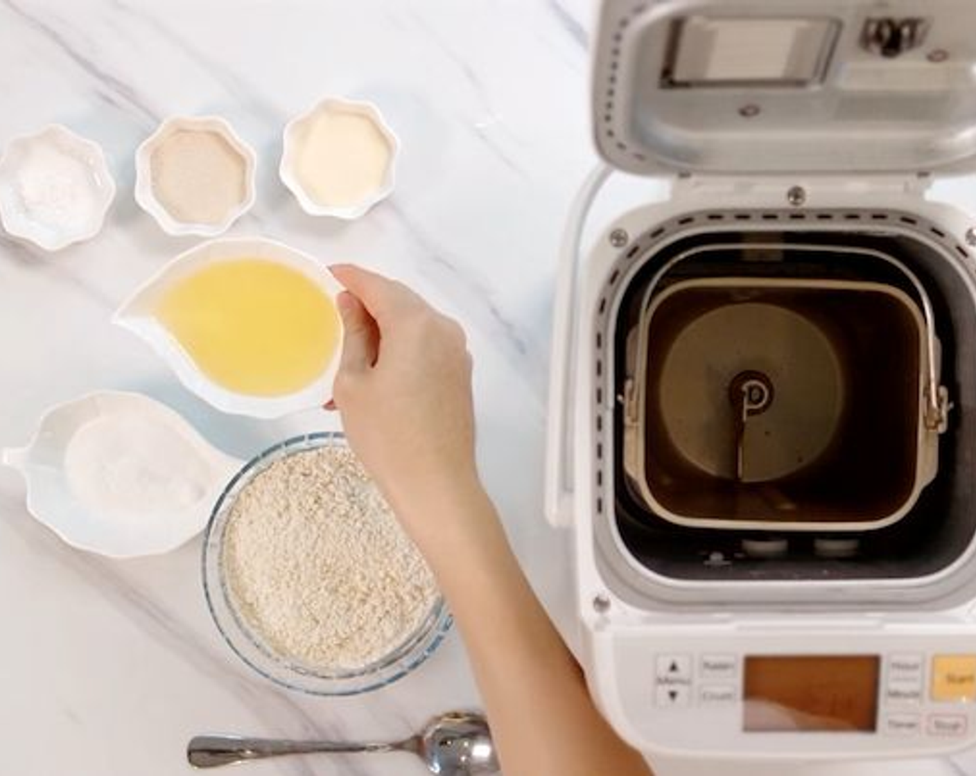 step 1 Put the Bread Flour (2 cups), Soy Milk Powder (1 Tbsp), Instant Dry Yeast (1/2 Tbsp), Granulated Sugar (1 1/2 Tbsp), Salt (1/2 tsp), Water (3/4 cup) and Vegetable Oil (2 1/2 Tbsp) into a bread maker starting from the wet ingredients. You could also use a stand mixer with a dough attachment instead.