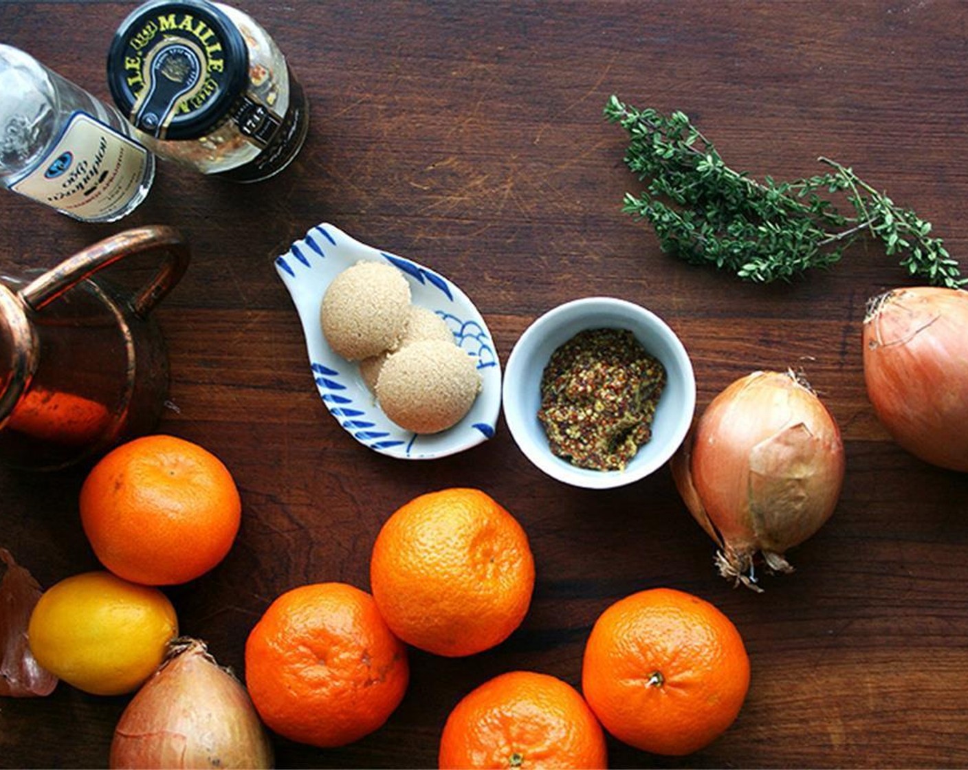 step 2 In a large mixing bowl, whisk together Arak (3 Tbsp), Olive Oil (1/4 cup), the juice from Orange (1) and Lemon (1), Whole Grain Mustard (2 Tbsp), Honey (3 Tbsp), and Kosher Salt (1/2 Tbsp).