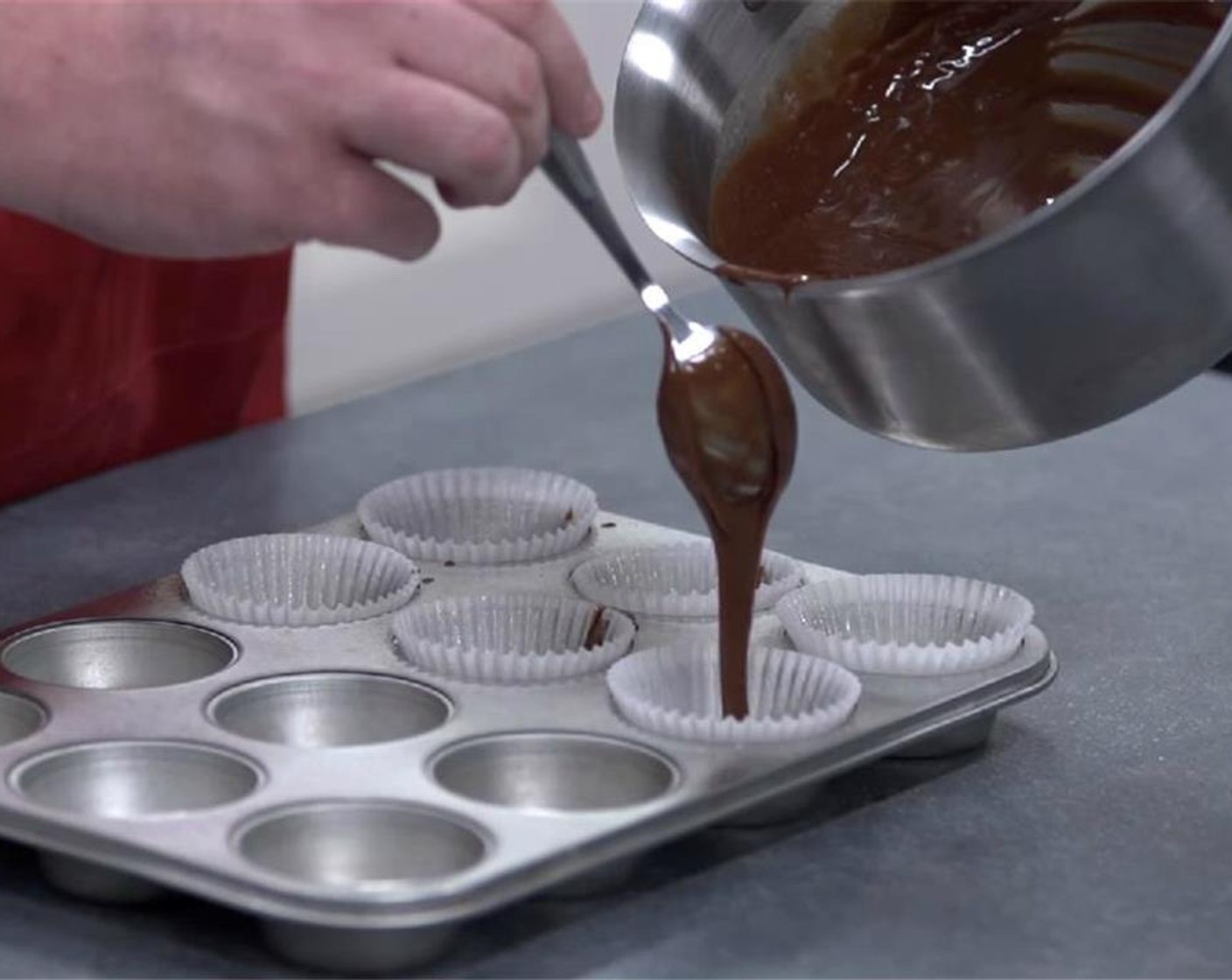 step 7 Spoon chocolate mixture into the lined muffin tin. Bake for 20 minutes or until the outside is just set and still wobbly in the center. You can use a toothpick to check and make sure it's not overbaked.