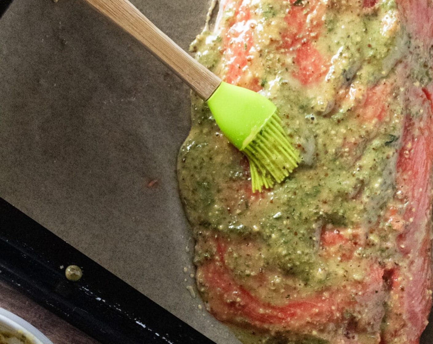 step 3 Place Salmon Fillets (1.5 lb) flesh side up on prepared baking sheet. Pour mustard mixture over the entire salmon filet, spreading it evenly over the entire flesh using a silicone basting brush or the back of a spoon.