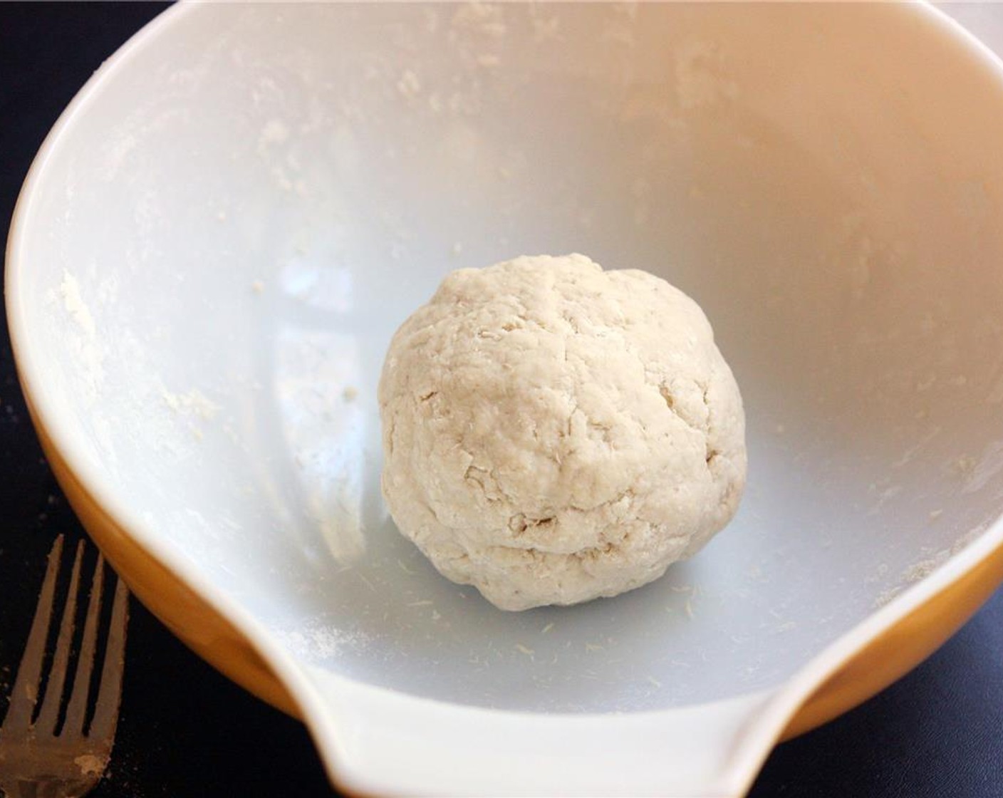 step 2 Add as much of the remaining Water (1/2 cup) as you need to gather all dry ingredients into the dough. Dough should be very stiff and not sticky. Form dough into a ball and leave it in the bowl.