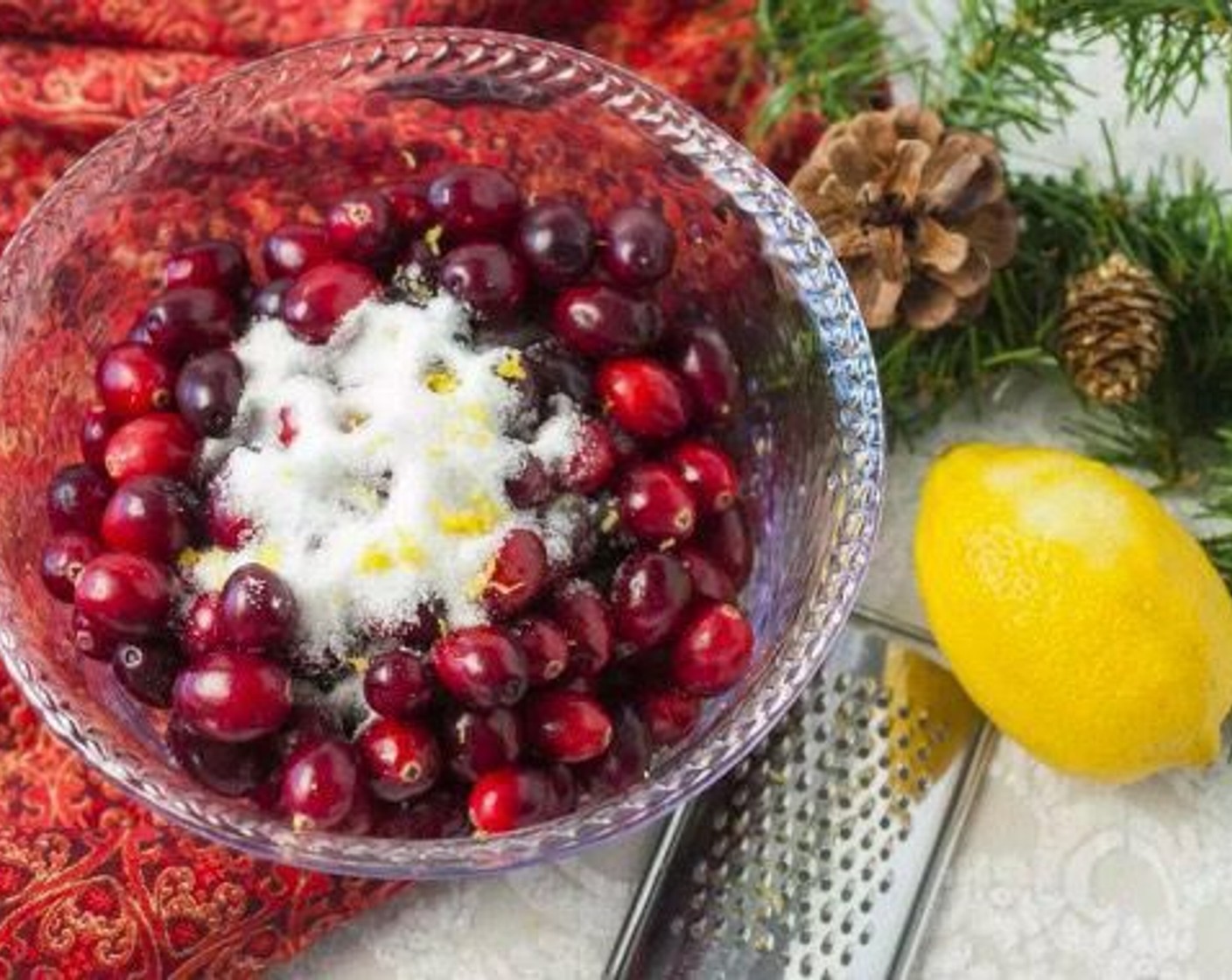 step 2 In a medium bowl, toss together Fresh Cranberries (2 3/4 cups), Granulated Sugar (1/2 cup), Water (1/4 cup), zest and juice from Lemon (1), Ground Ginger (1/4 tsp), Ground Nutmeg (1 pinch), Salt (1 pinch), and Coarse Sugar (to taste). Spread in a single layer on a small baking sheet.