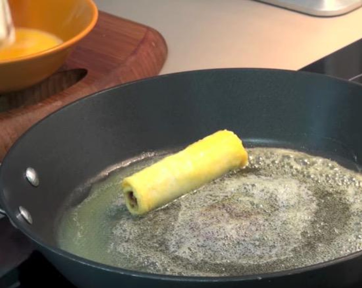 step 5 Preheat a frying pan and put Butter (2 Tbsp) in. Once the butter is melted and bubbly, dip each one of the bread rolls into the egg mixture, shake off any excess and place it straightly into the pan. Keep going with the rest. Let it cook for about a minute per side or until they are nice and golden.