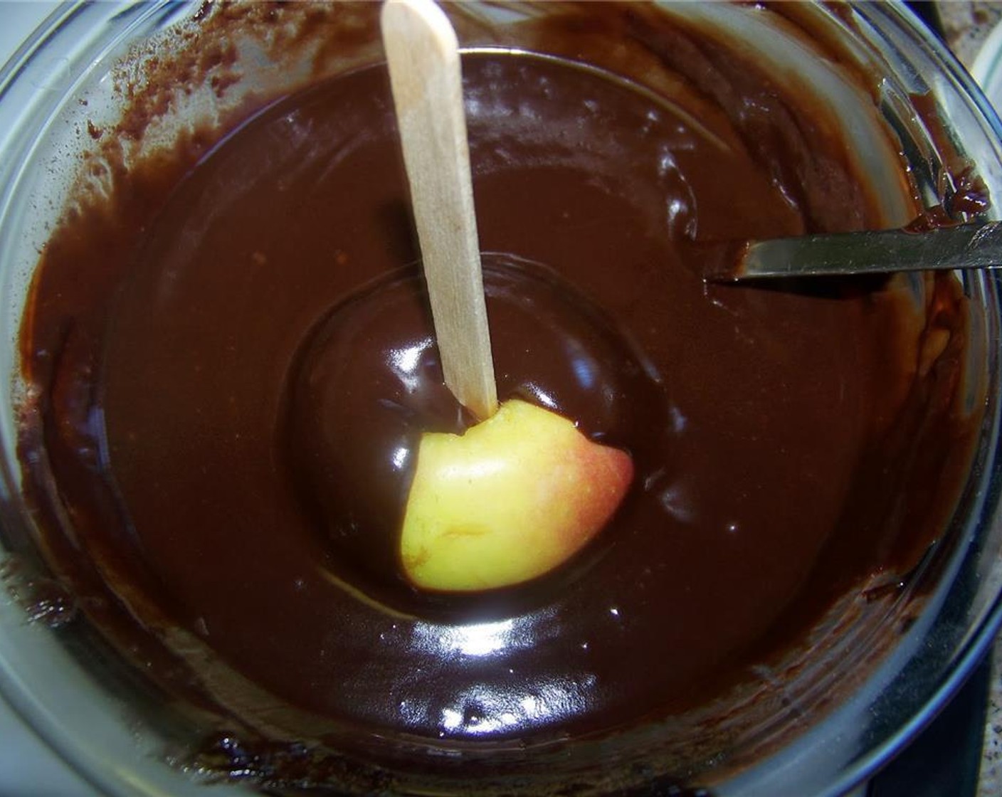 step 4 Dip apples into the melted chocolate and then sprinkle or dip into M&M's® Milk Chocolate Candy (to taste), Sweetened Coconut Flakes (to taste), Chocolate Sprinkles (to taste), or your favorite garnishes.