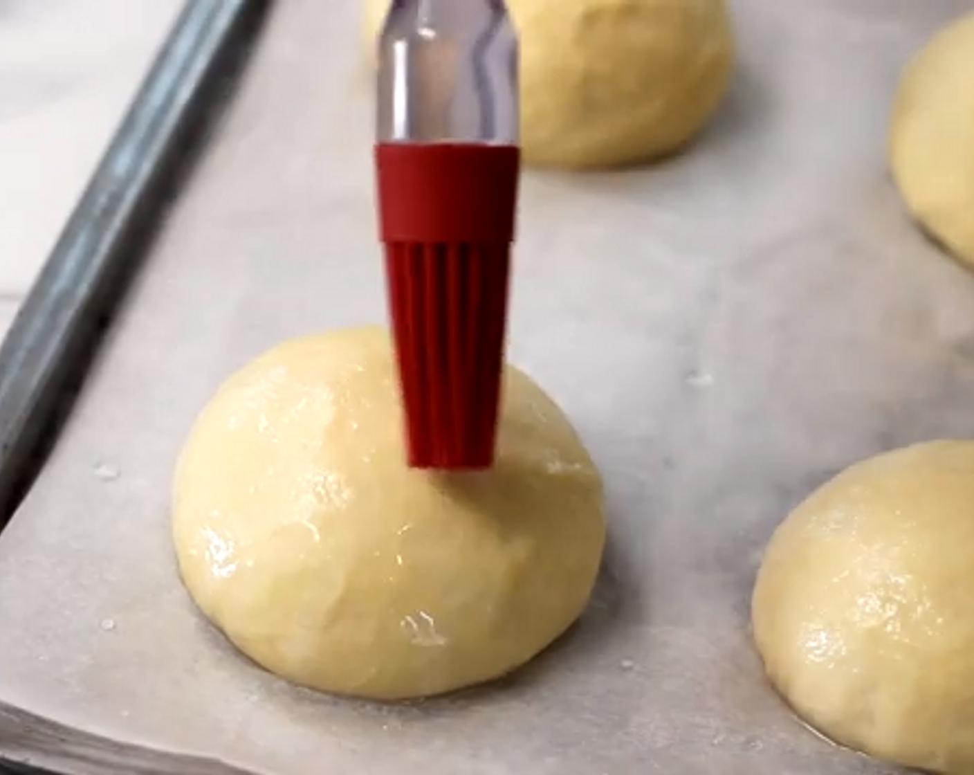 step 7 Brush water onto each dough ball and bake in an oven for about 15-20 minutes.