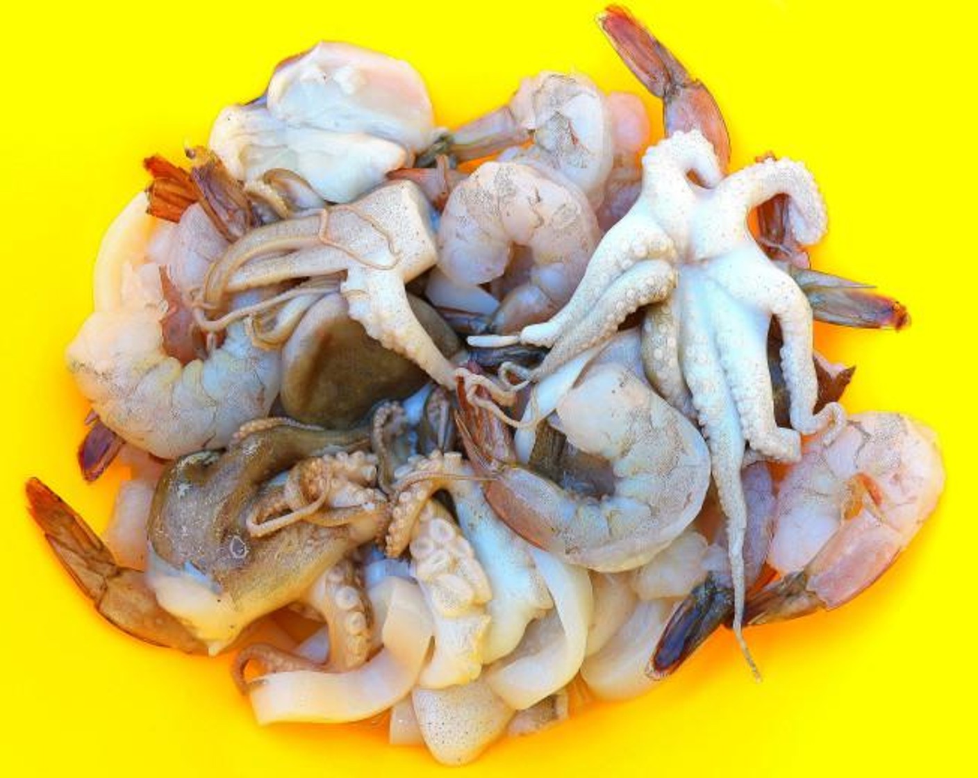 step 1 Season Baby Octopus (6 oz), Shrimp (21) and Squid Rings (6 oz) with Kosher Salt (to taste), Cayenne Pepper (to taste), Lime Juice (to taste) and Granulated Garlic (to taste).