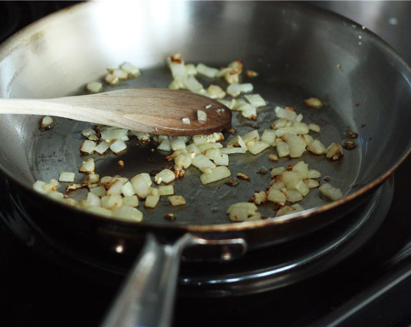 step 1 Heat Olive Oil (1 tsp) in a small saucepan over medium heat. Add Yellow Onion (1/2 cup) and Garlic (2 cloves), and cook until onion is translucent and garlic has just a bit of color.
