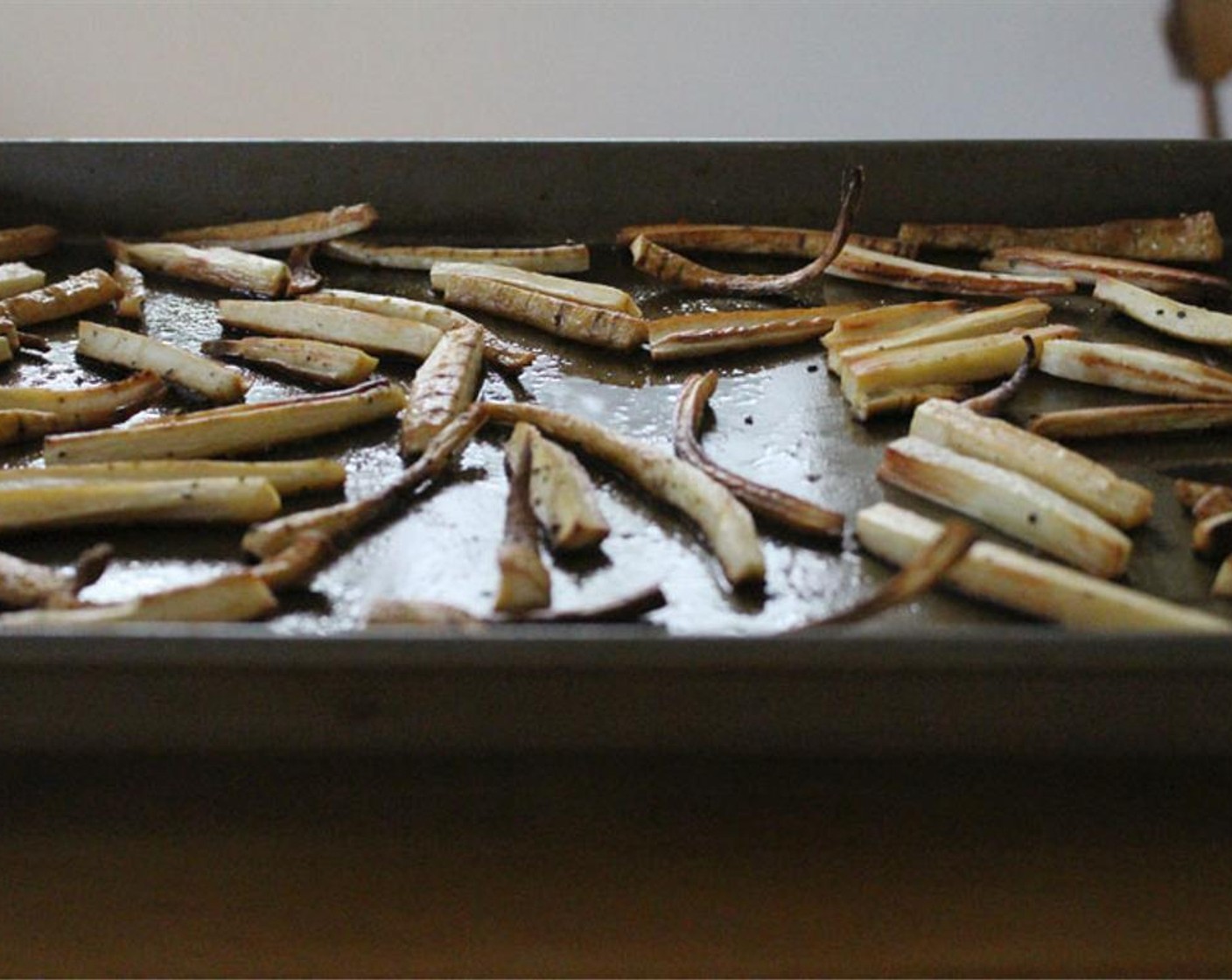 step 4 After, flip the parsnips, rotate position in the oven, and bake for about 10 minutes more (or until parsnips are crispy outside, tender inside).