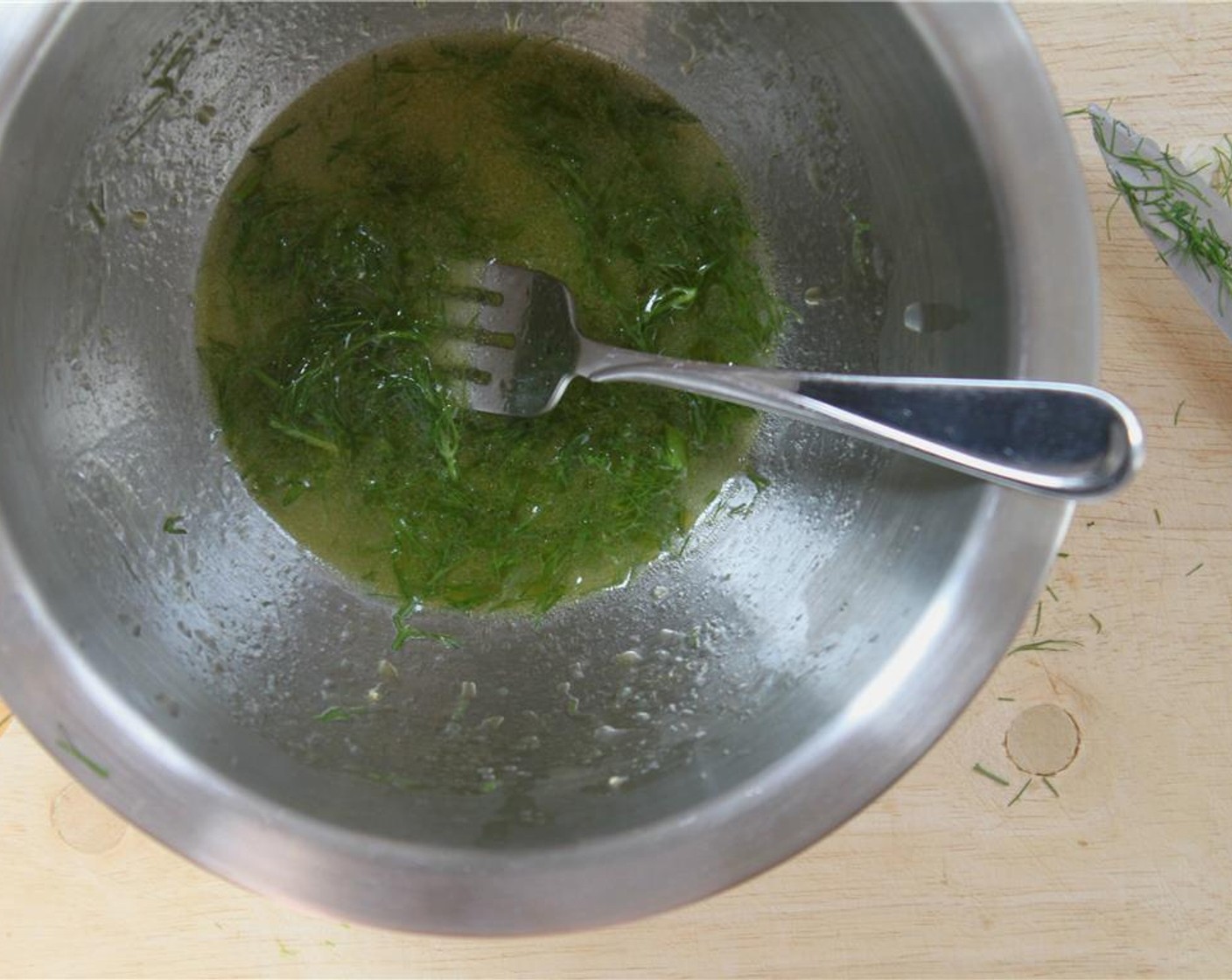 step 4 Juice the Lemon (1) in a mixing bowl. Whisk it together with the Olive Oil (1 1/2 Tbsp), Salt (1 tsp), and 1-2 tablespoons of the fine fennel leaves for the dressing.  Toss the shaved fennel and sliced citrus in the dressing.