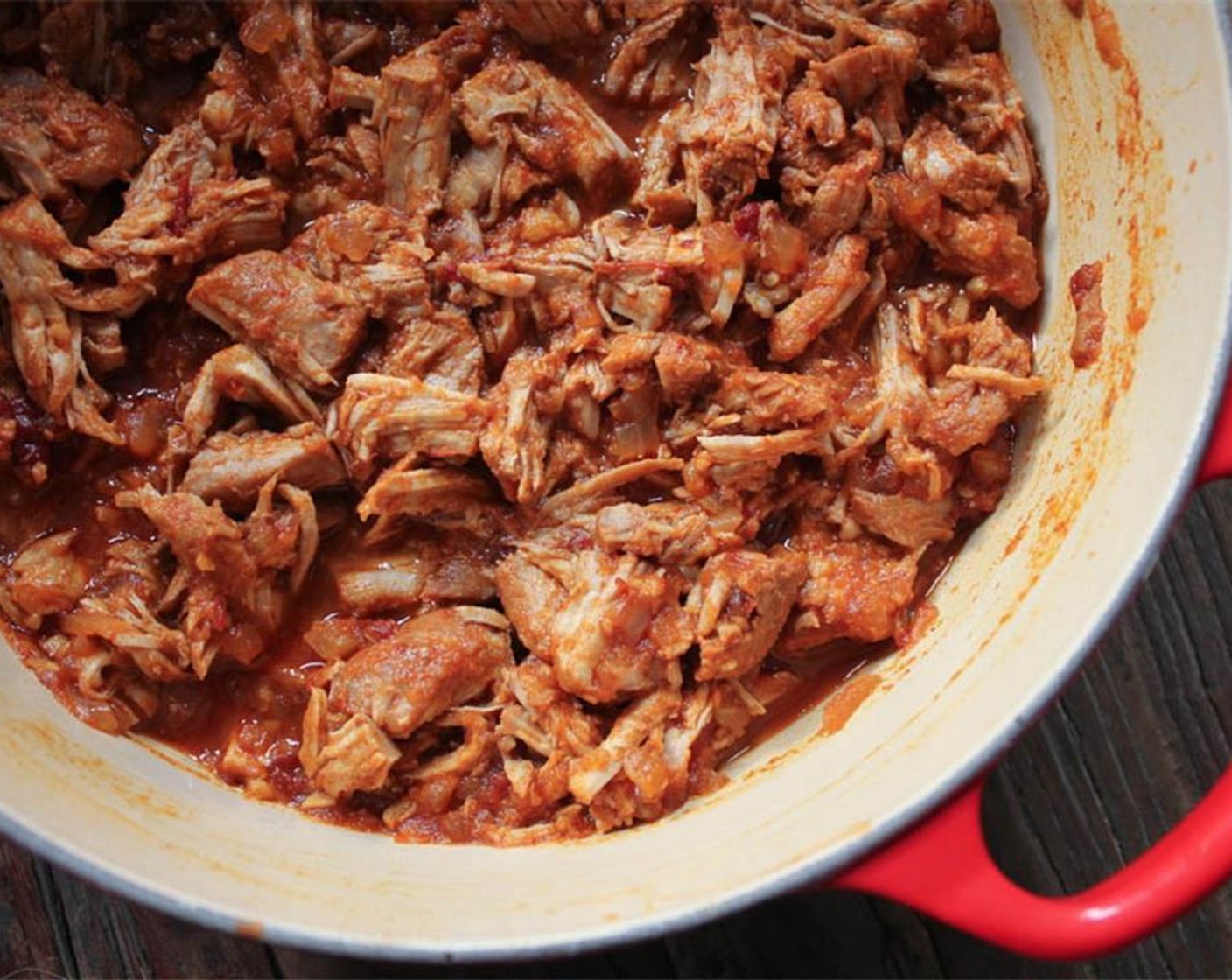 step 11 Return the shredded pork to the sauce and continue cooking uncovered for about five minutes until the sauce has thickened.