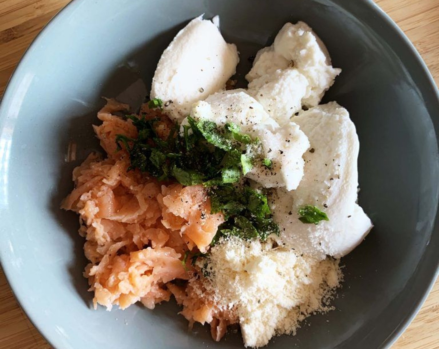 step 2 In a large bowl combine the Smoked Salmon (3.5 oz), Ricotta Cheese (1/3 cup), Grated Parmesan Cheese (2 Tbsp) and Fresh Parsley (1 Tbsp).