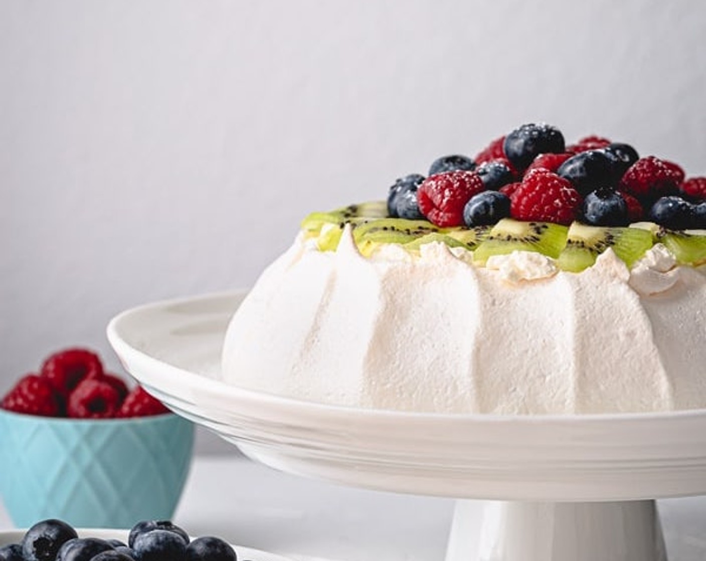 step 12 When you are ready to serve, top the pavlova with whipped cream frosting and Fresh Fruits (to taste) your choice.