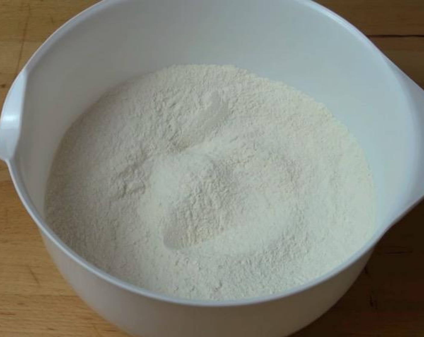 step 1 In a large mixing bowl, add Self-Rising Flour (1 1/2 cups), Baking Powder (1/2 tsp) and Caster Sugar (1/2 cup). Mix together to combine.