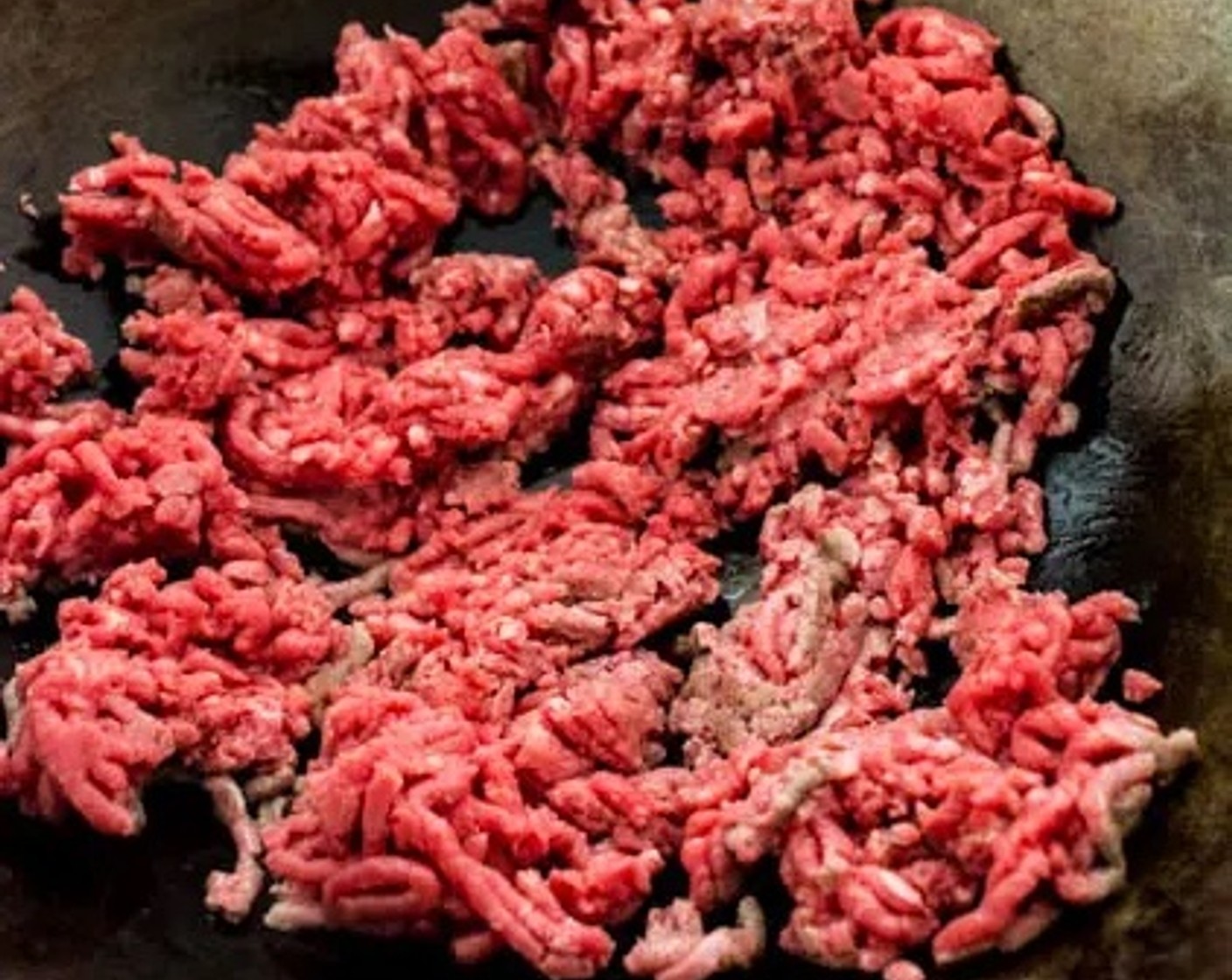 step 2 Add Ground Beef (1 lb) to the wok. Spread the ground beef out as much as possible into a thin layer so it cooks quickly and evenly. Stir-fry the ground beef until fully cooked.