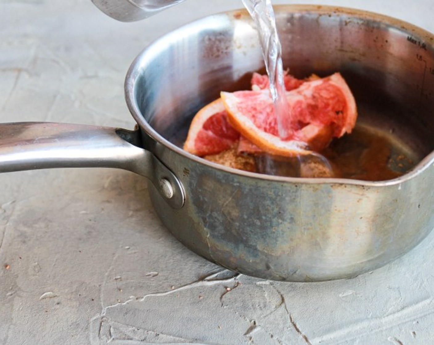 step 2 While the black tea is steeping, begin making simple syrup. Add Granulated Sugar (1/2 cup), Water (1 1/2 cups), and 4-5 slices of Grapefruit (1) to a saucepan on medium stirring periodically.