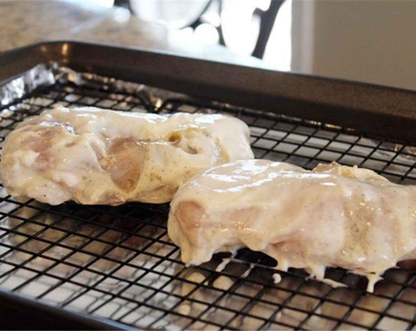 step 6 After it's finished marinating, place the chicken on an oven safe rack to prepare to broil them.