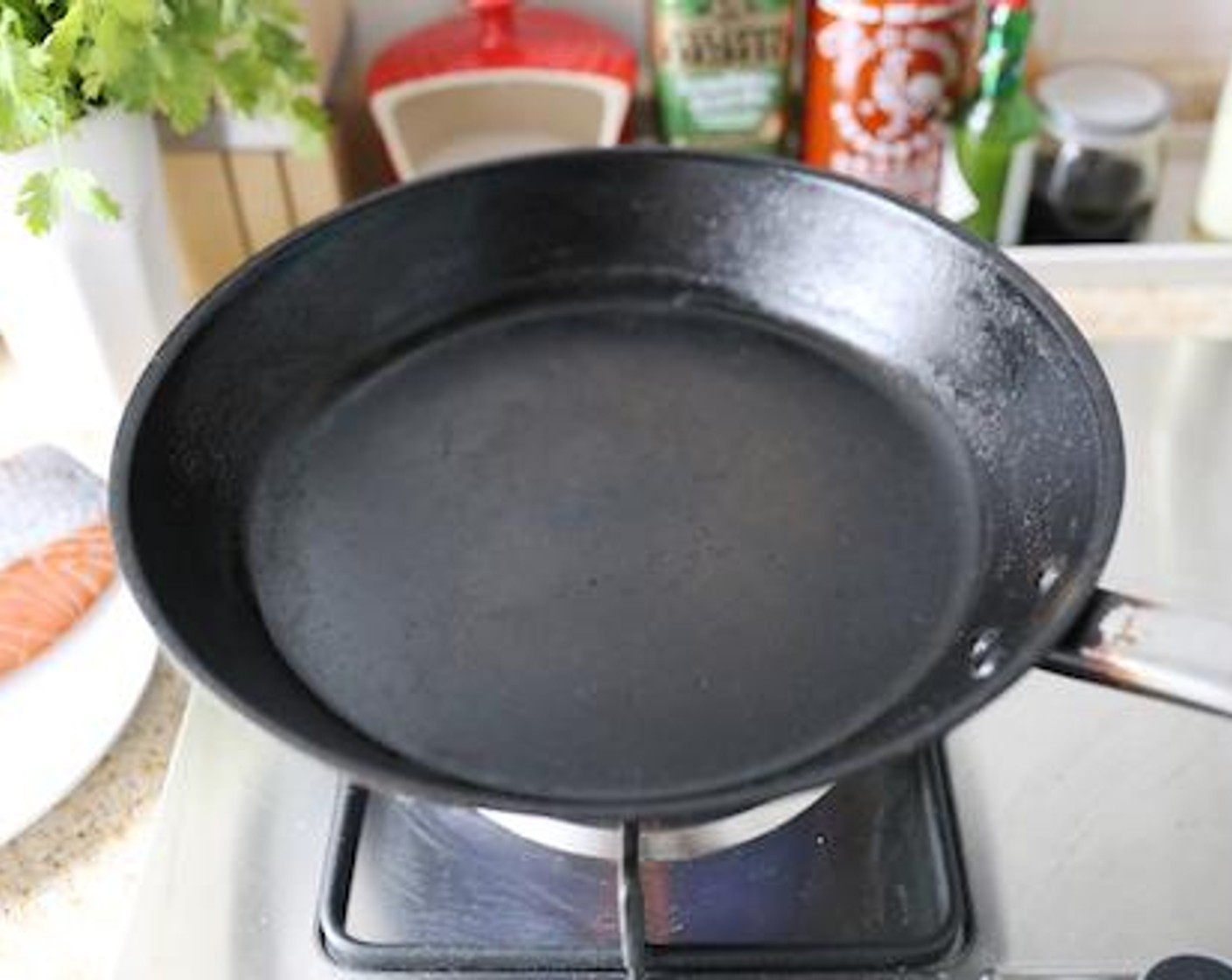 step 1 Heat your pan over medium heat WITHOUT OIL. As the pan heats up, pat the Salmon Fillet (1 in) dry with a paper towel.