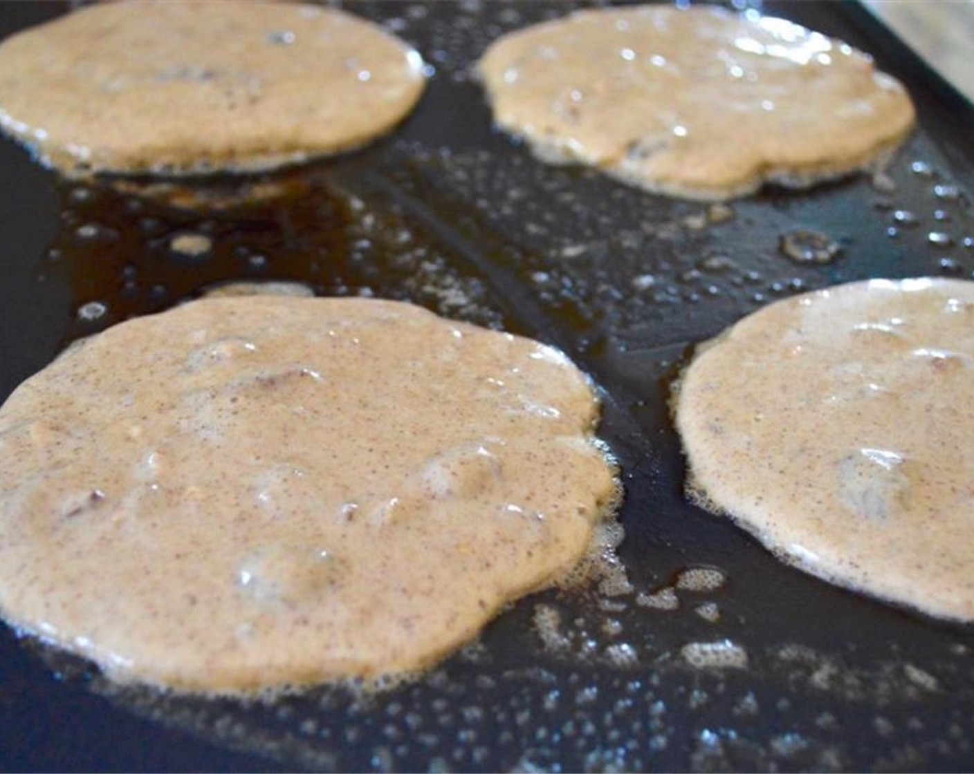 step 7 Grease the griddle well with Butter (to taste). Scoop the desired amount of batter per pancake onto the griddle in batches and let them cook for about 3 minutes on each side.