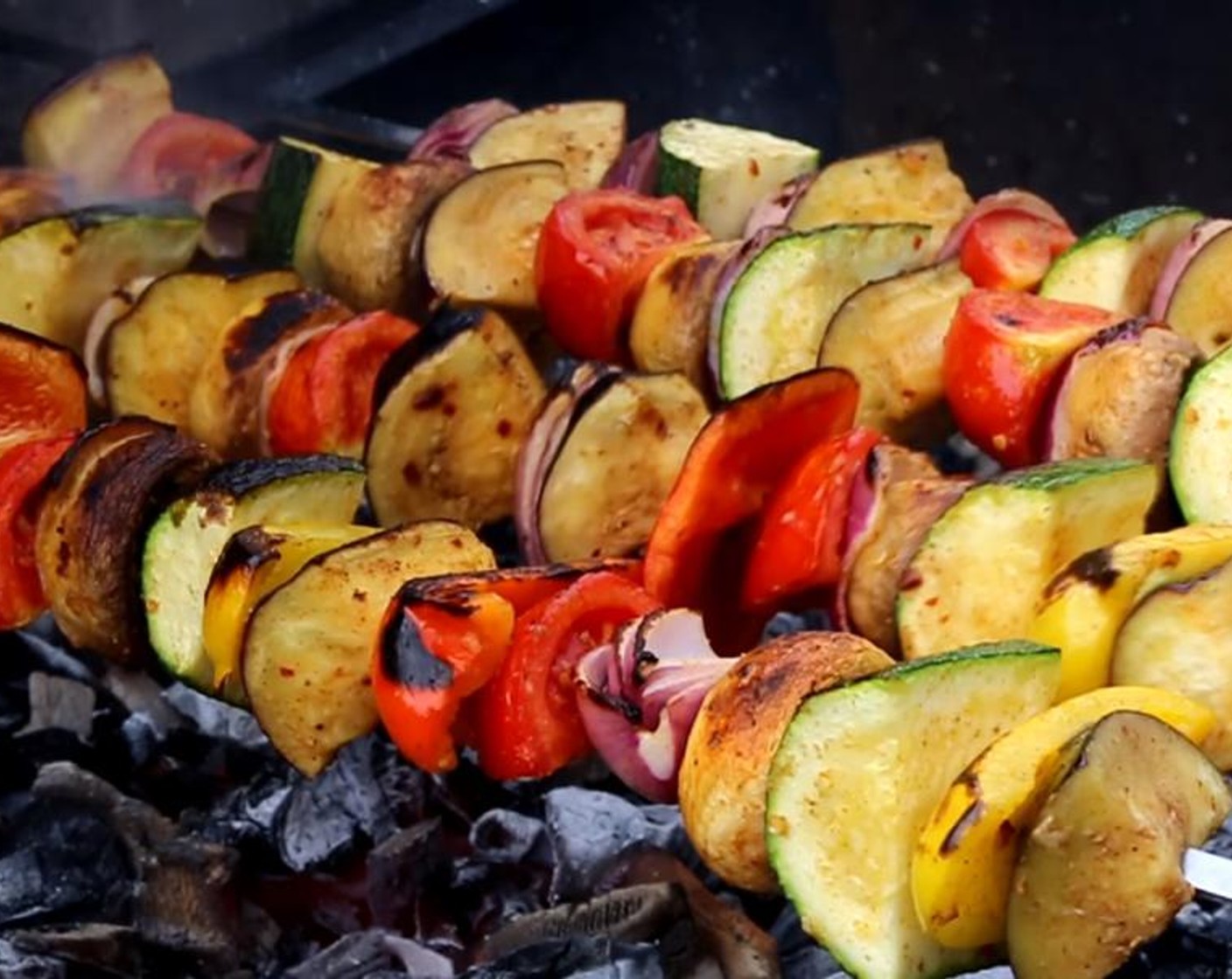 step 6 Place the skewers on the working grill. Occasionally rotate them to let the vegetables cook from all sides.