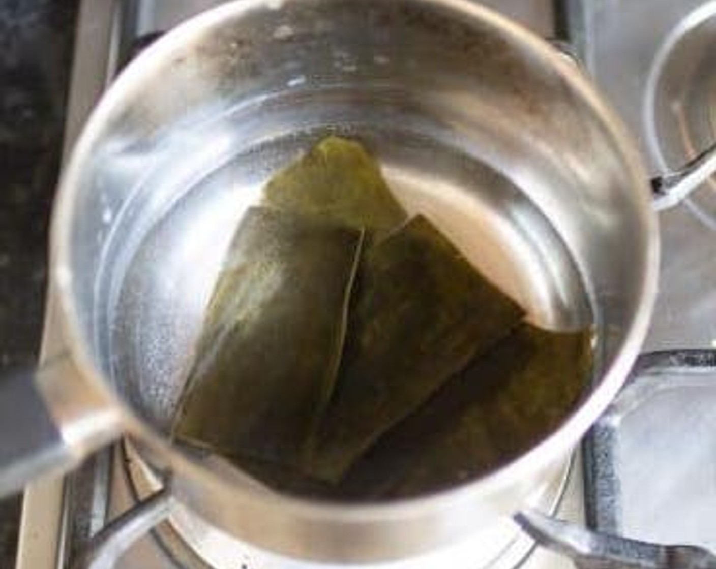 step 1 Heat Water (3/4 cup) in a medium-sized saucepan on high heat until it starts to boil. Add in the Kombu (2 tsp) and reduce to medium-low heat. Cover the pan with a lid and simmer for 10 minutes.