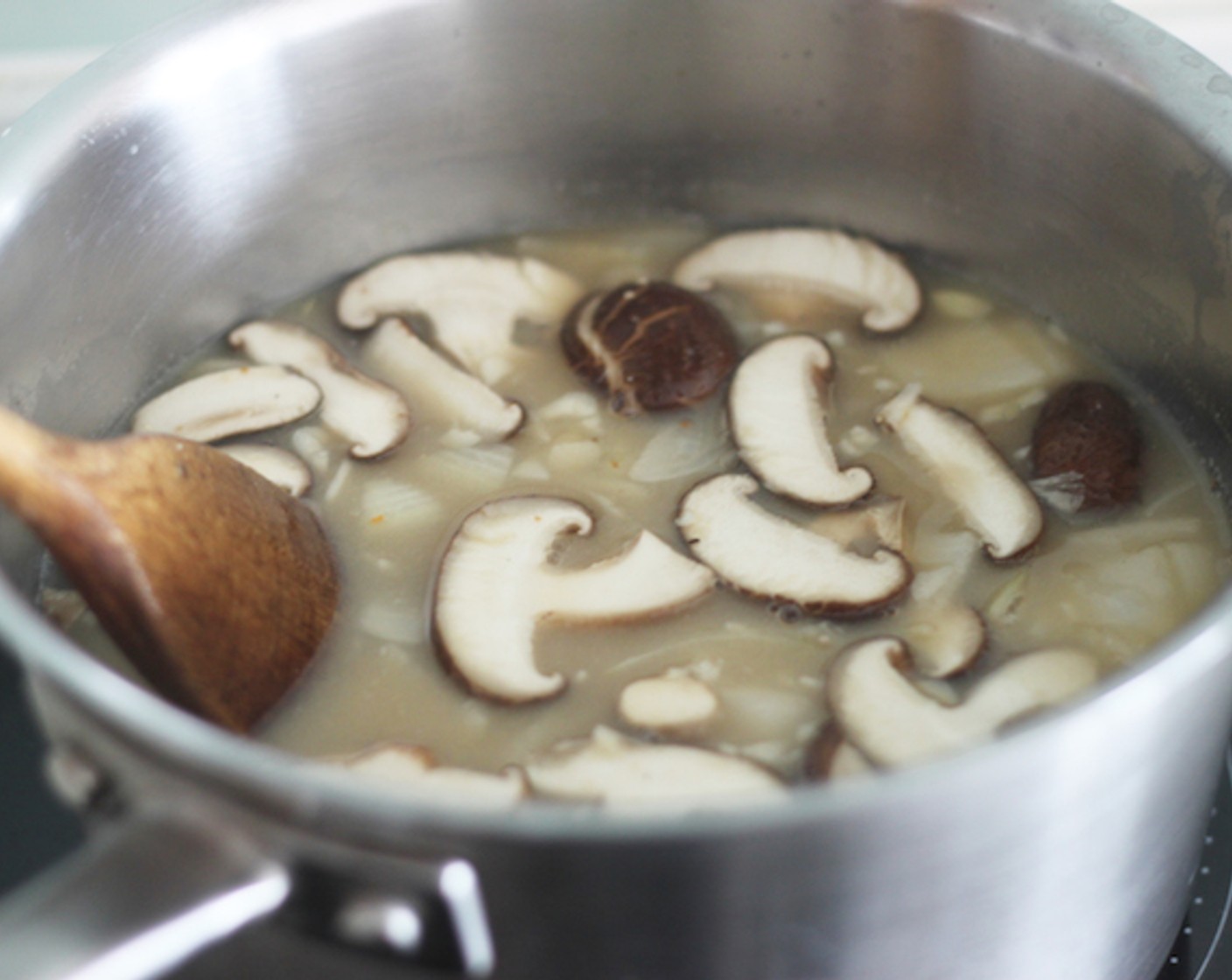 step 8 Add the mushroom and you’re all done making the ramen broth! Cover the pot with a lid and cook for another 5 minutes or so.